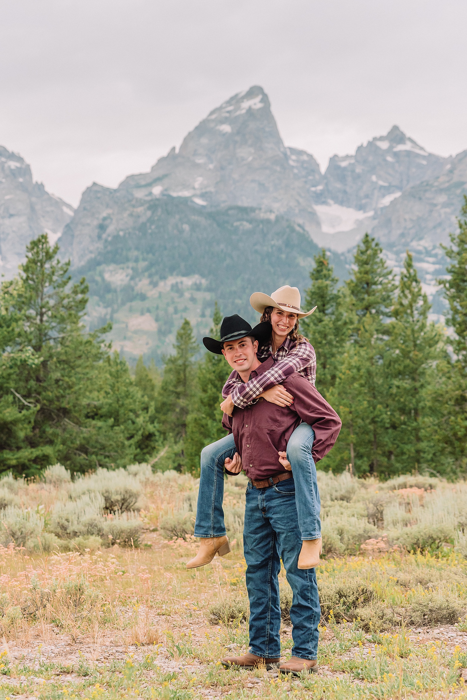 outdoor family photos with baby Grand Tetons purple western shirt family portraits Wyoming cream plaid toddler outdoor photos mountains flexible outdoor photography session inclement weather Jackson Hole Photographer Grand Teton National Park family photographer
