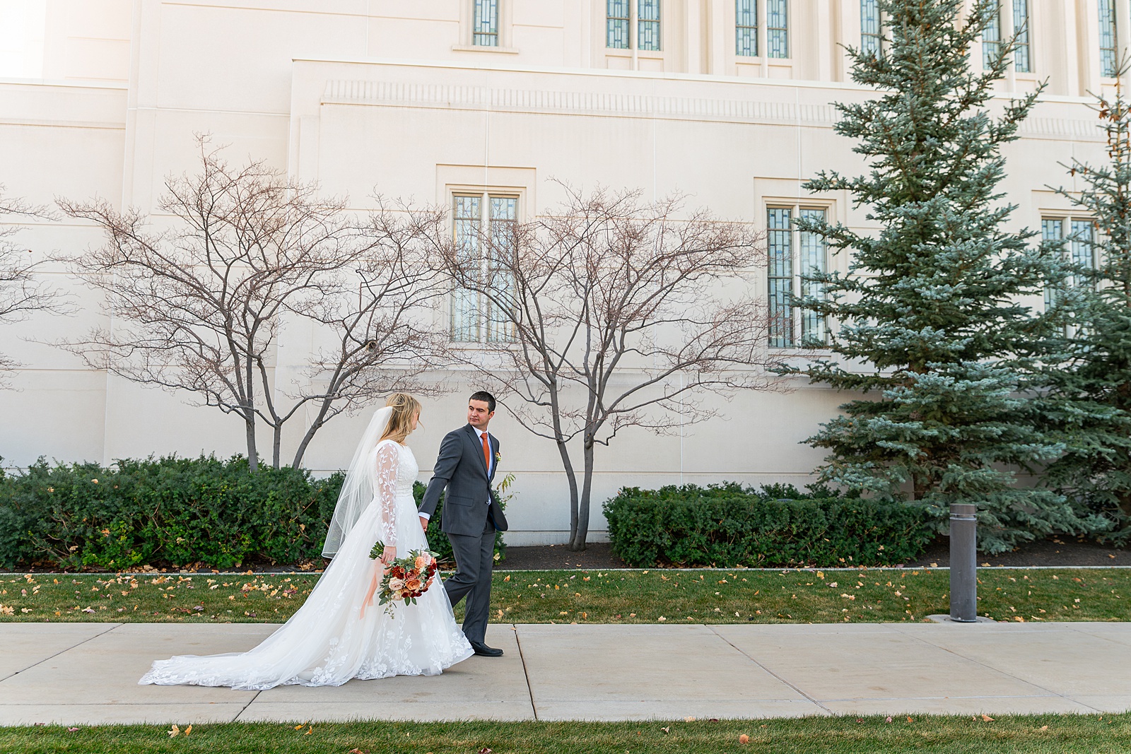 Rexburg Idaho Temple wedding photography in November LDS temple wedding photographer Rexburg Idaho bride getting ready at The Aisle venue Sugar City Idaho bridal party getting ready Sugar City Idaho wedding venue father daughter first look before LDS temple wedding ring ceremony with family and friends Idaho wedding sparkler exit with light sticks at Idaho wedding reception November wedding photography Rexburg Idaho no snow