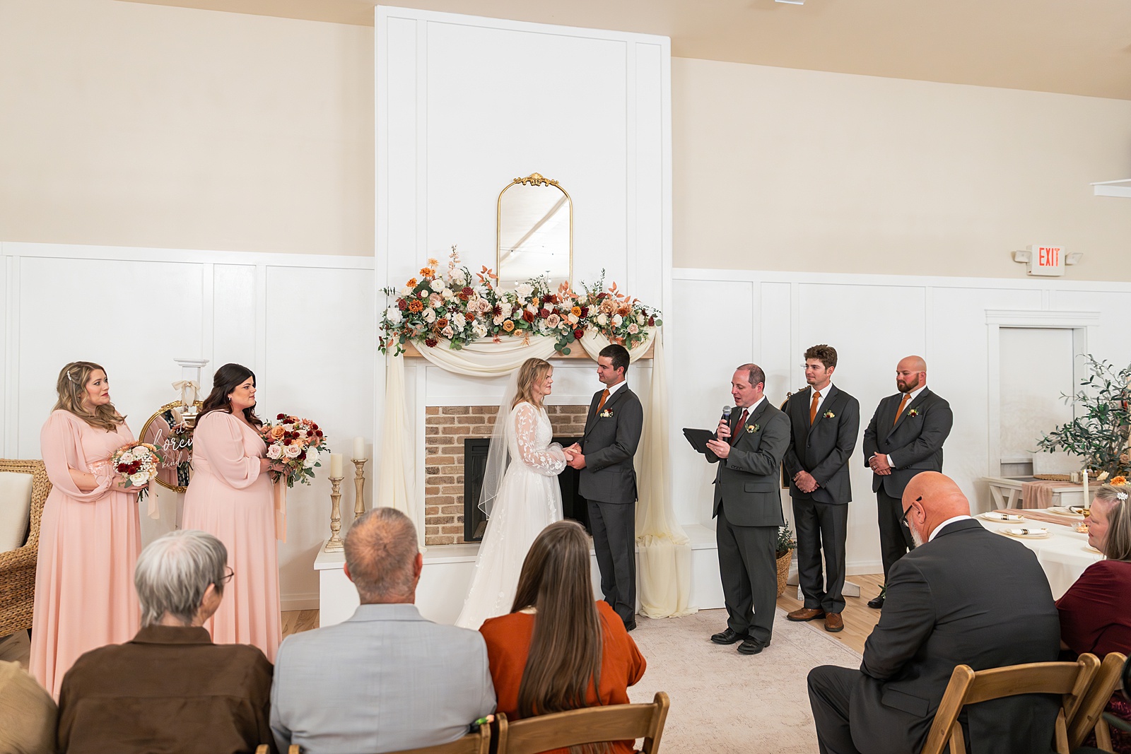 Rexburg Idaho Temple wedding photography in November LDS temple wedding photographer Rexburg Idaho bride getting ready at The Aisle venue Sugar City Idaho bridal party getting ready Sugar City Idaho wedding venue father daughter first look before LDS temple wedding ring ceremony with family and friends Idaho wedding sparkler exit with light sticks at Idaho wedding reception November wedding photography Rexburg Idaho no snow
