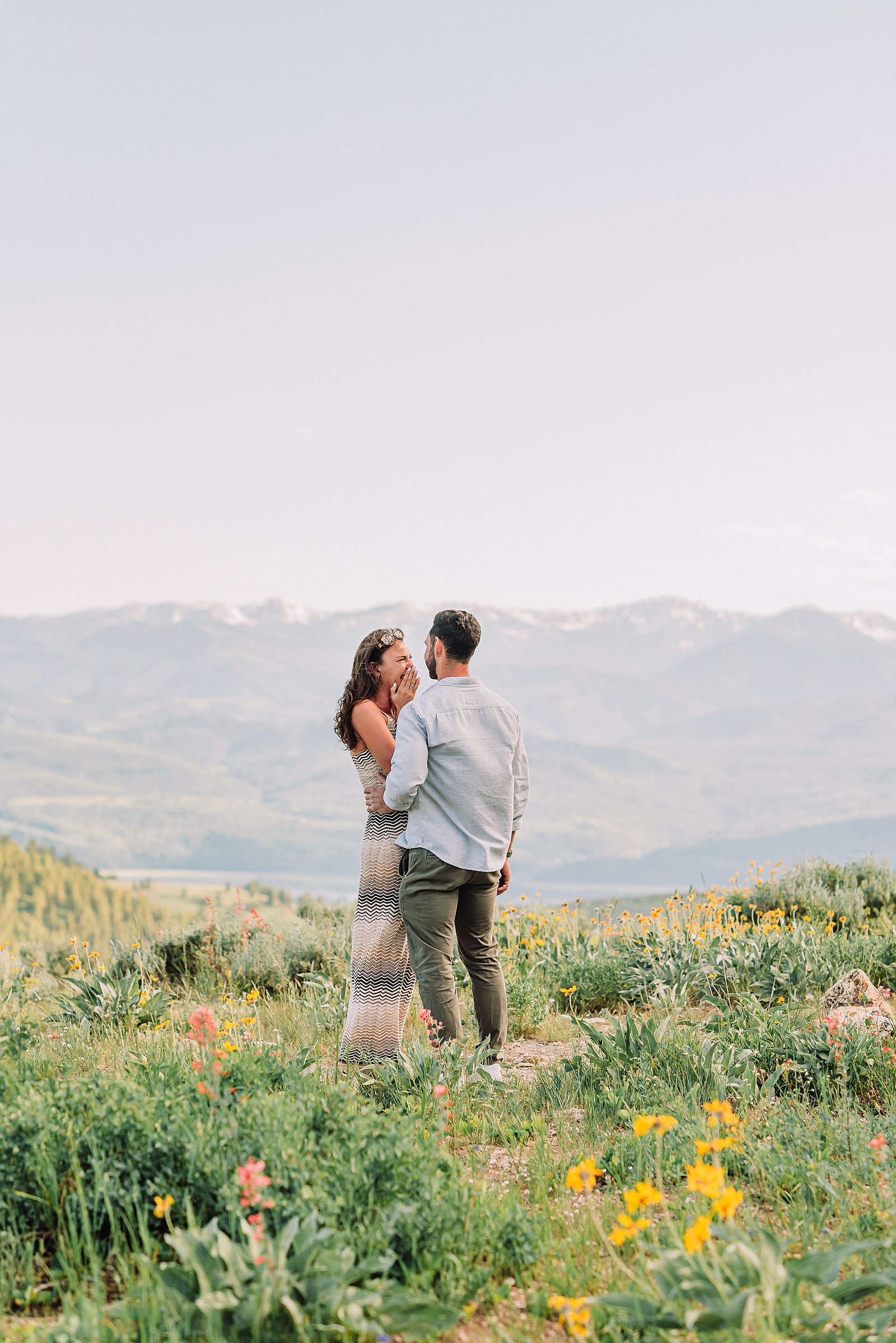 Snow King Mountain surprise proposal photography Jackson Hole wildflower engagement photos gondola engagement session Wyoming Snow King resort proposal photographer wildflower engagement photos Wyoming
