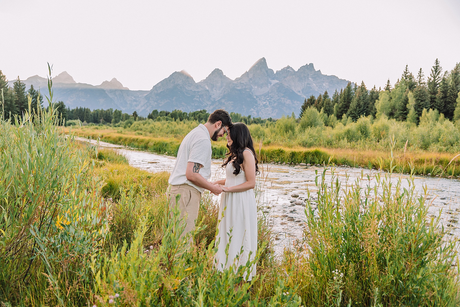 dreamy lighting engagement photography Jackson Hole area romantic Schwabacher Landing couples photography session Grand Teton National Park fall engagement pictures candid mountain engagement photos natural posing Wyoming Jackson Hole Photographer