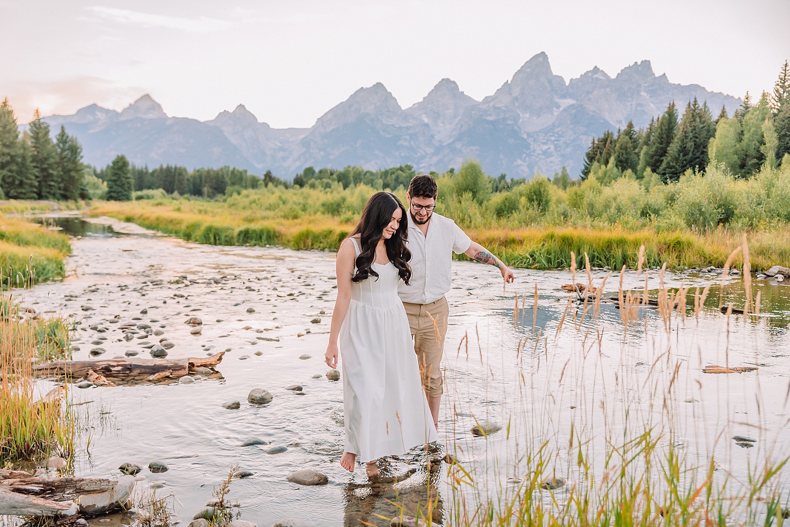 dreamy lighting engagement photography Jackson Hole area romantic Schwabacher Landing couples photography session Grand Teton National Park fall engagement pictures candid mountain engagement photos natural posing Wyoming Jackson Hole Photographer