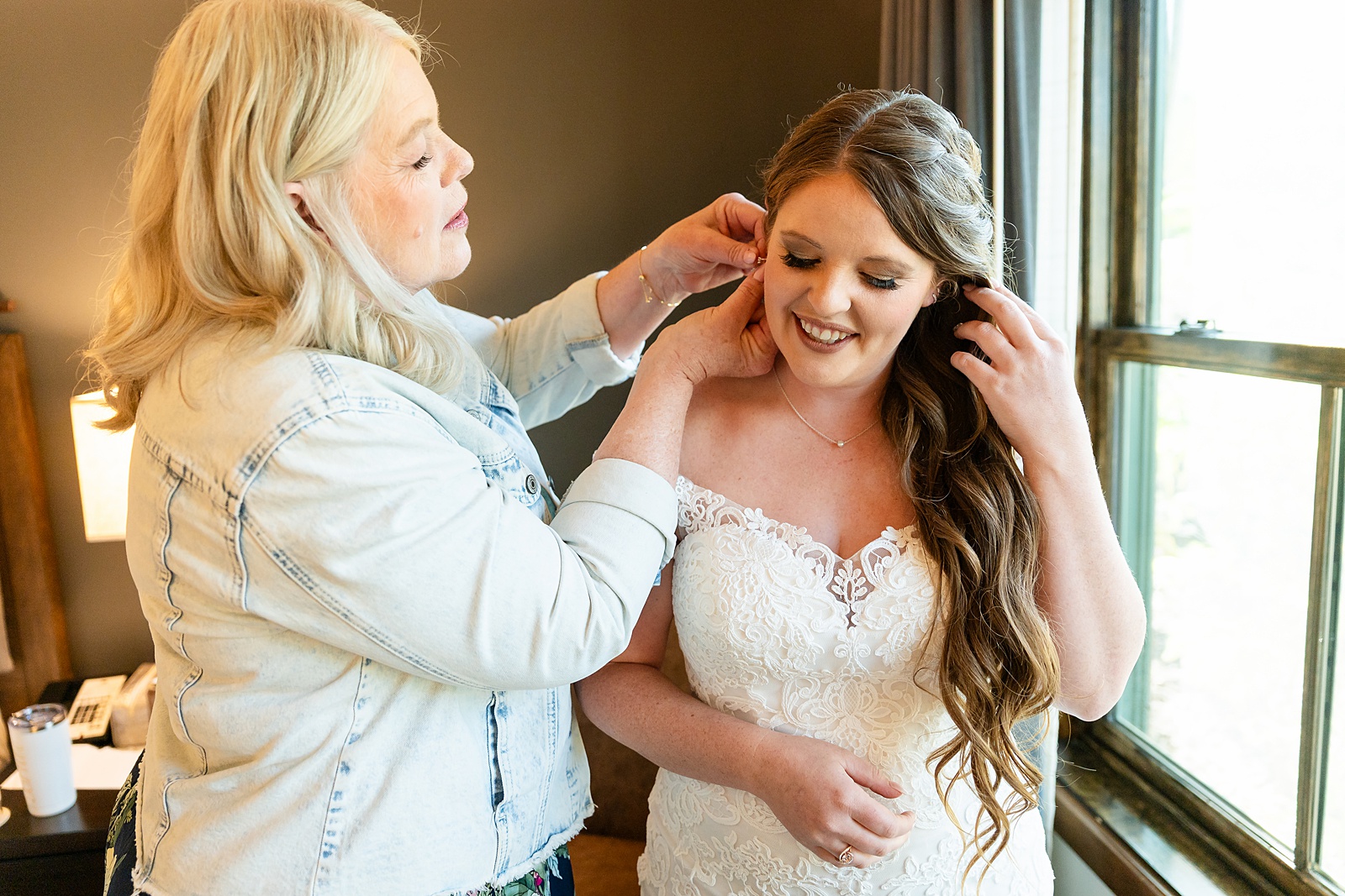 getting ready photos Teton Mountain Lodge Spa bride pre-wedding photos Bridal prep at Jackson Hole resort vow books and rings custom ring boxes