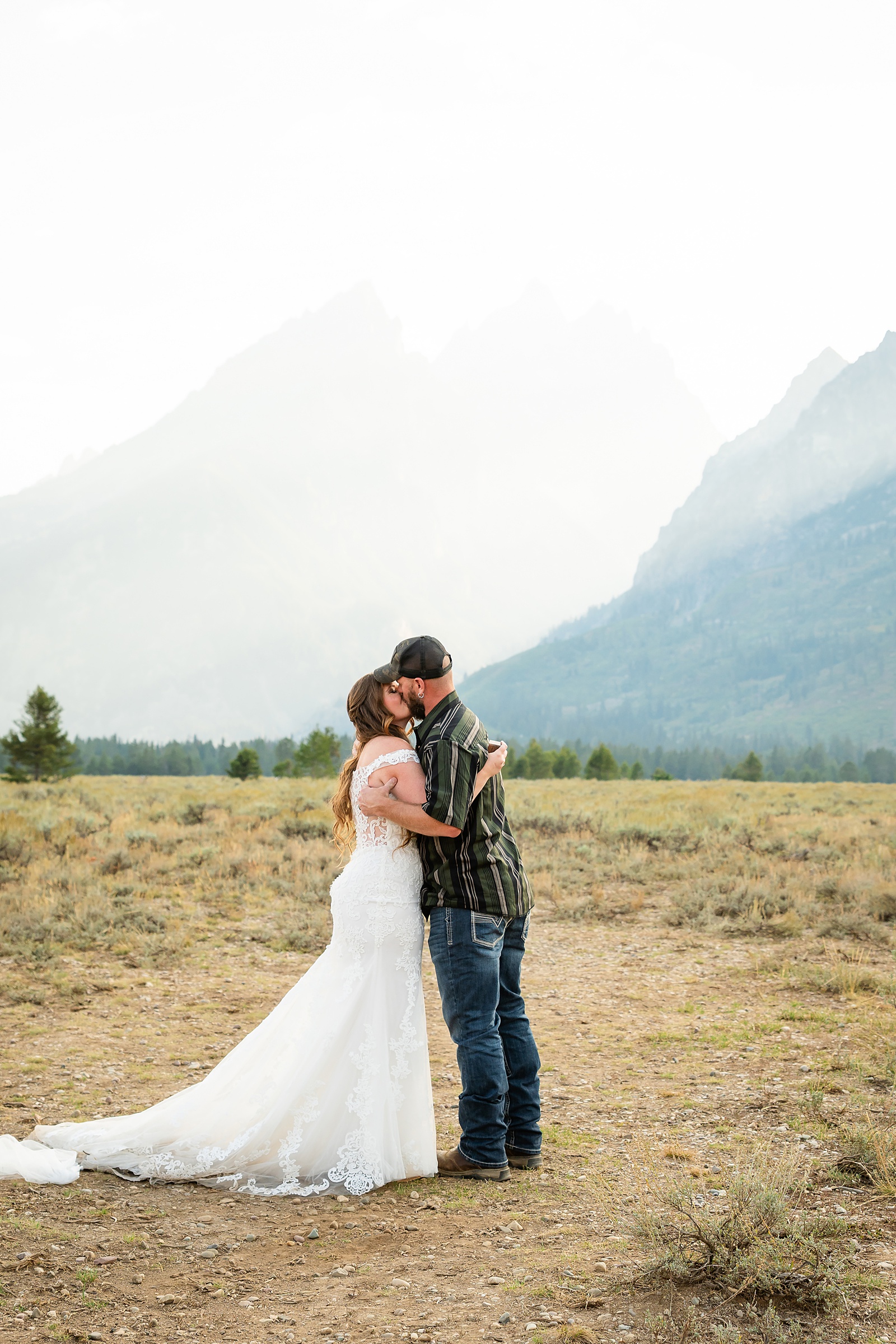 Teton Mountains elopement photography intimate ceremony Cathedral View Turnout wedding photographer Wyoming bride with white cowgirl boots mountain wedding intimate family elopement Teton National Park