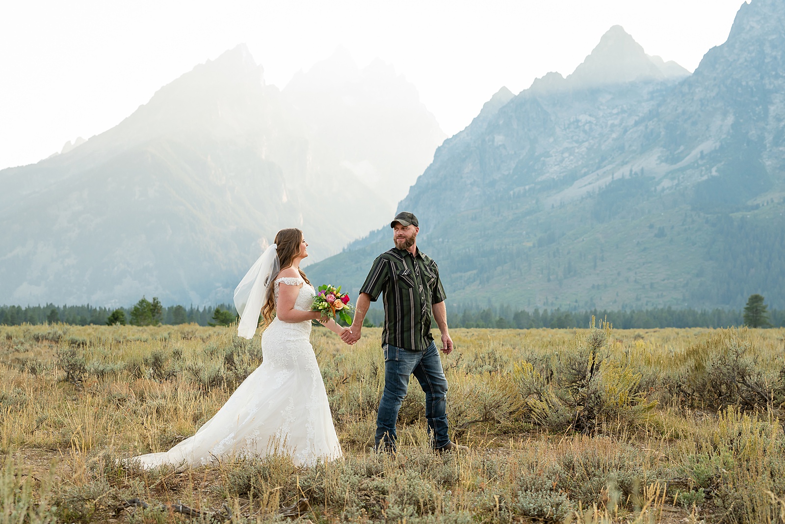 Teton Mountains elopement photography intimate ceremony Cathedral View Turnout wedding photographer Wyoming bride with white cowgirl boots mountain wedding intimate family elopement Teton National Park
