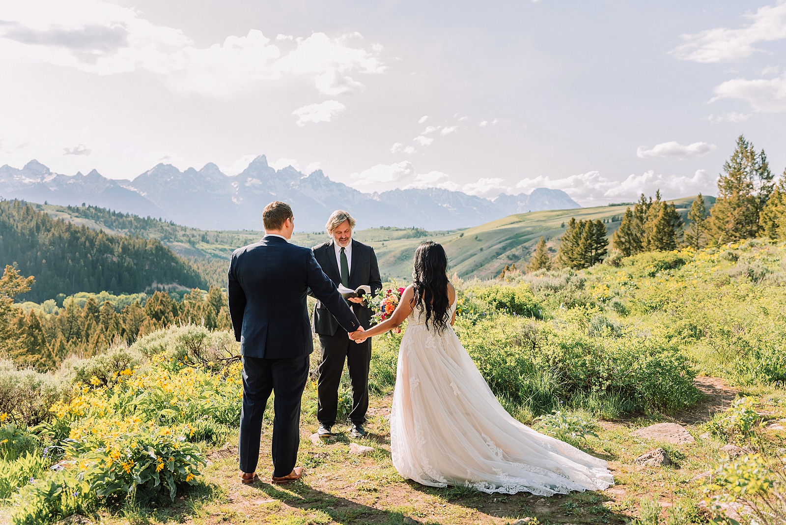 Bridger-Teton National Forest wedding ceremony photography The Wedding Tree elopement portraits Jackson Hole June wildflower wedding photography Wyoming mountains candid elopement photography Teton Range backdrop Jackson Hole Wedding Photographer Teton Mountains Wedding Photography