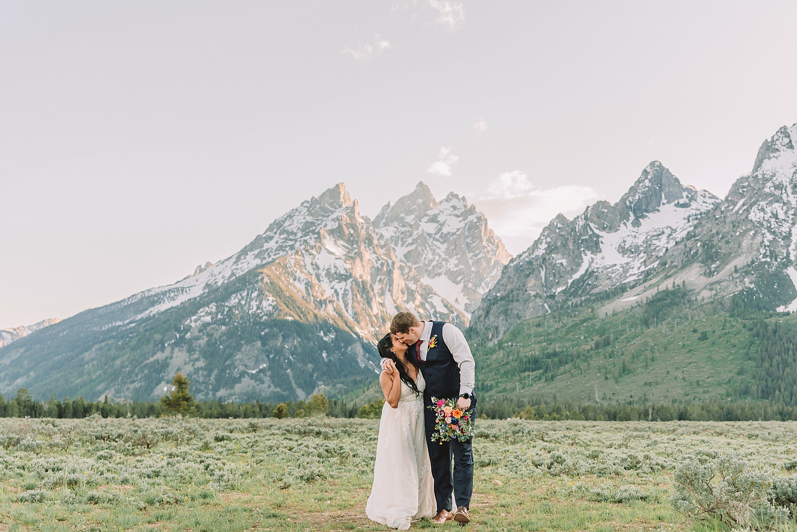 Cathedral View Turnout couple photos Grand Tetons candid elopement photography Teton Range backdrop playful elopement photos Grand Teton National Park intimate couple portraits Jackson Hole Wyoming outdoor wedding ceremony mountain backdrop photography