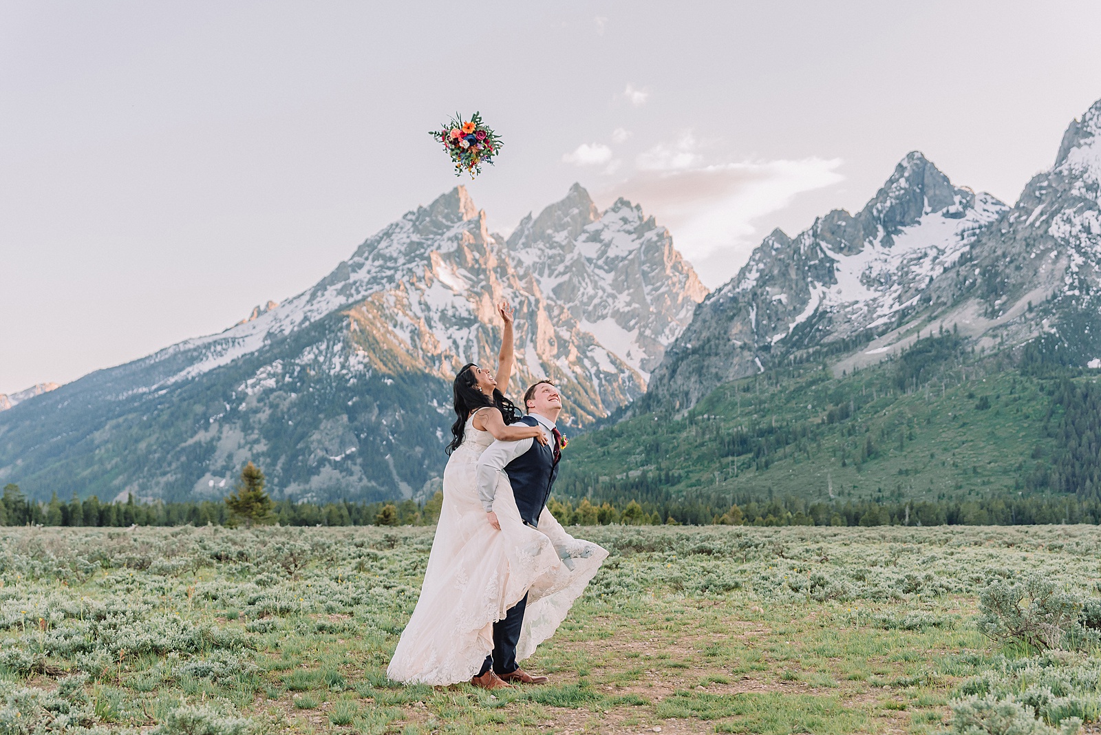 Cathedral View Turnout couple photos Grand Tetons candid elopement photography Teton Range backdrop playful elopement photos Grand Teton National Park intimate couple portraits Jackson Hole Wyoming outdoor wedding ceremony mountain backdrop photography