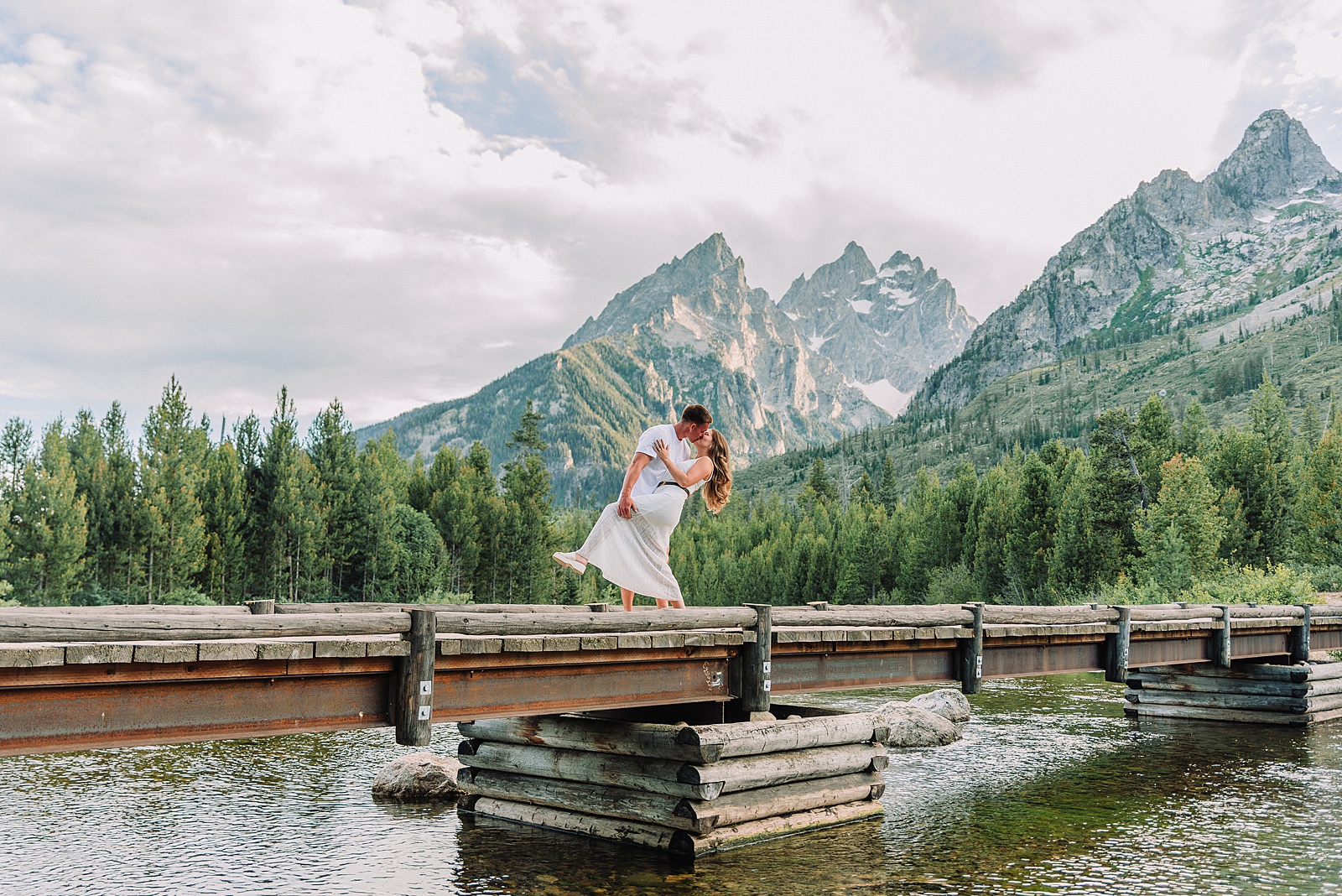 Jackson Hole Photographer Tetons engagement photos at String Lake Grand Teton National Park engagement session String Lake engagement photography Wyoming mountain engagement photos wooden bridge