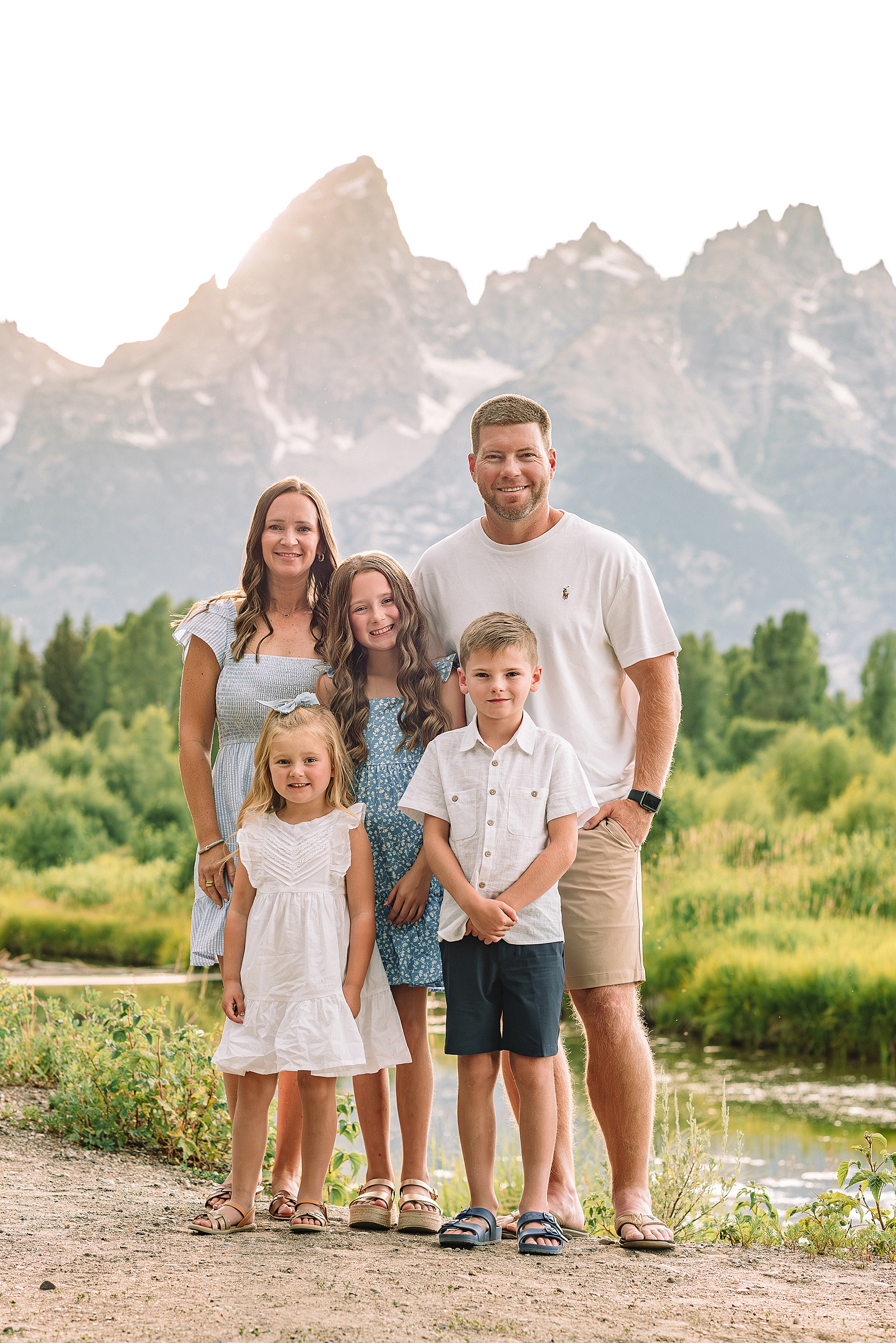 Schwabacher Landing family photos summer Grand Teton National Park family photographer what to wear for mountain family photos blue and white family photo outfits summer family session Jackson Hole