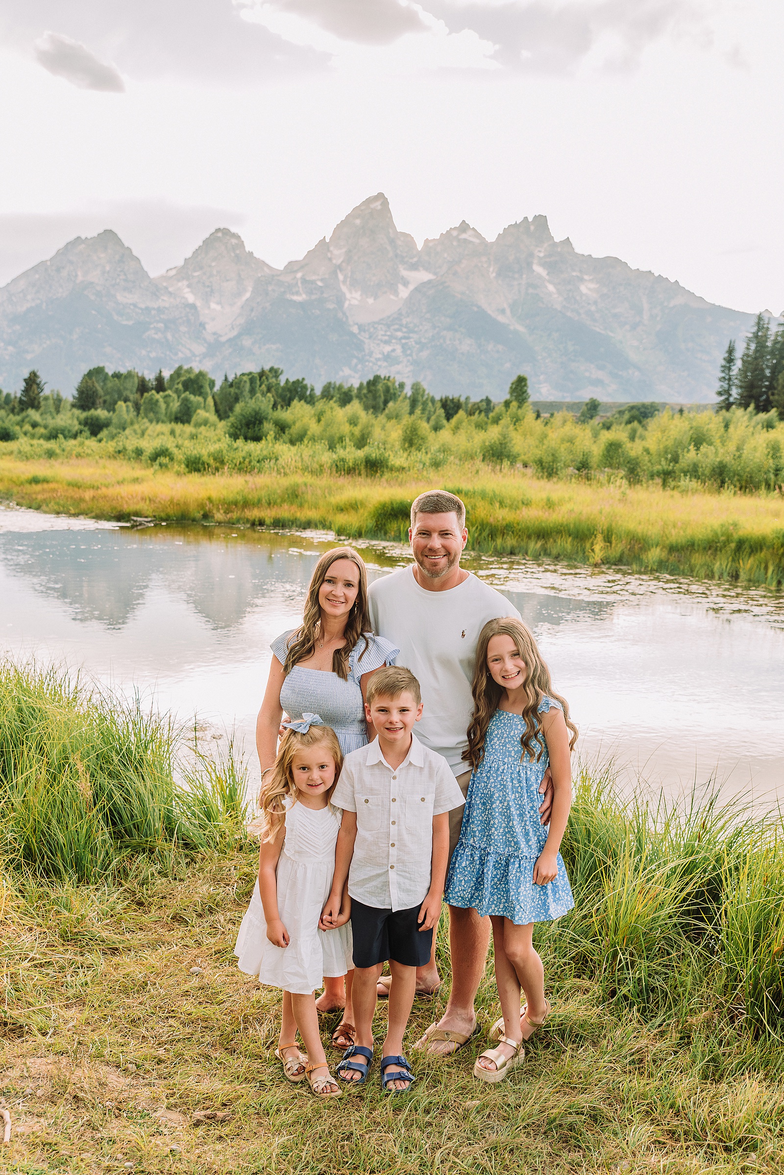 summer family session Jackson Hole Teton mountain backdrop family portraits coordinating family outfits without matching Grand Teton vacation photographer