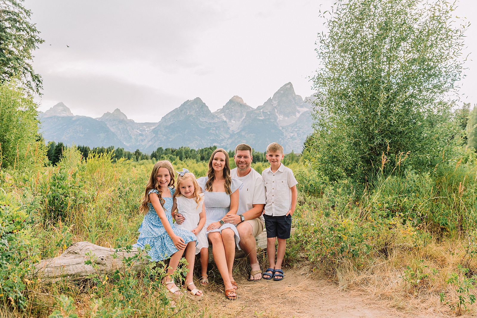 summer family session Jackson Hole Teton mountain backdrop family portraits coordinating family outfits without matching Grand Teton vacation photographer