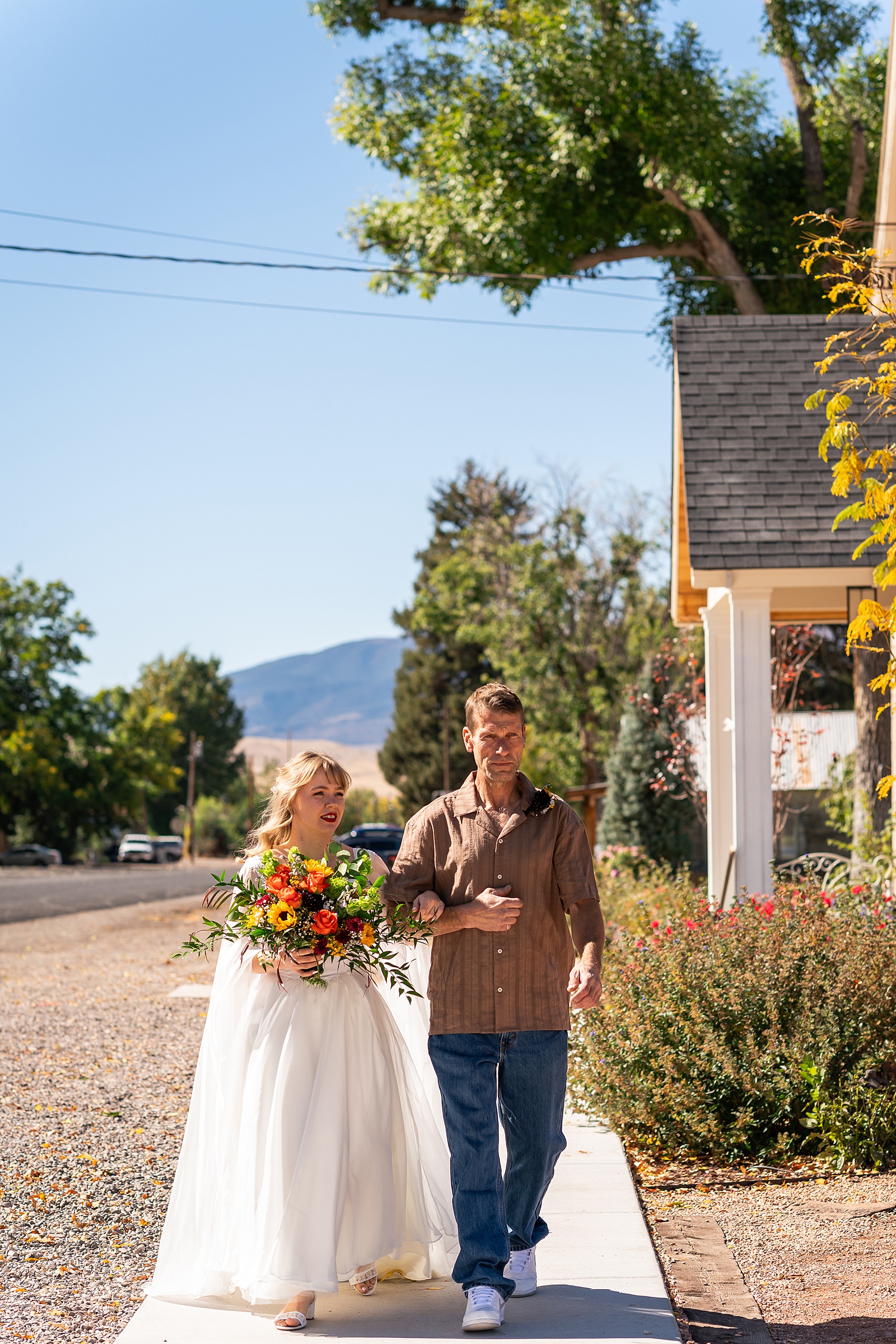 backyard elopement to wedding celebration handmade wedding arch ceremony photography Utah Wedding Photographer small town Utah wedding celebration