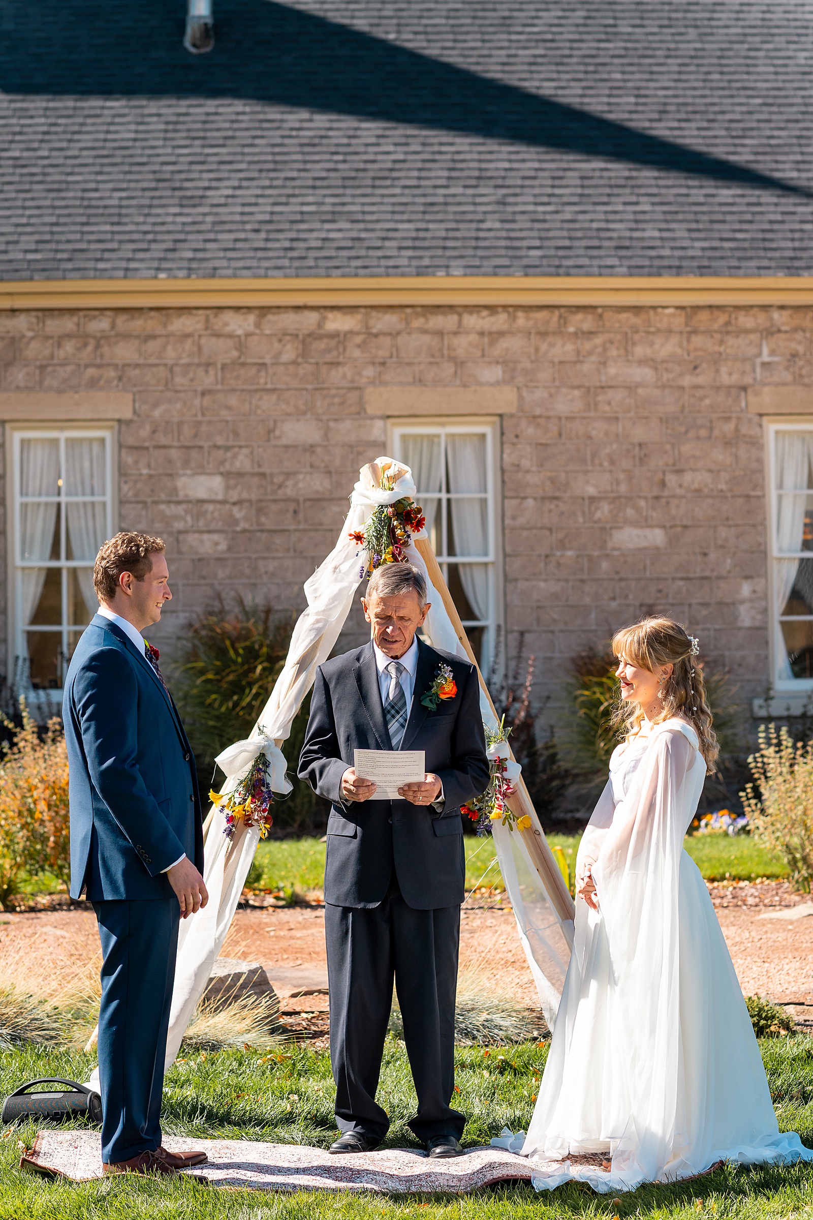 backyard elopement to wedding celebration handmade wedding arch ceremony photography Utah Wedding Photographer small town Utah wedding celebration
