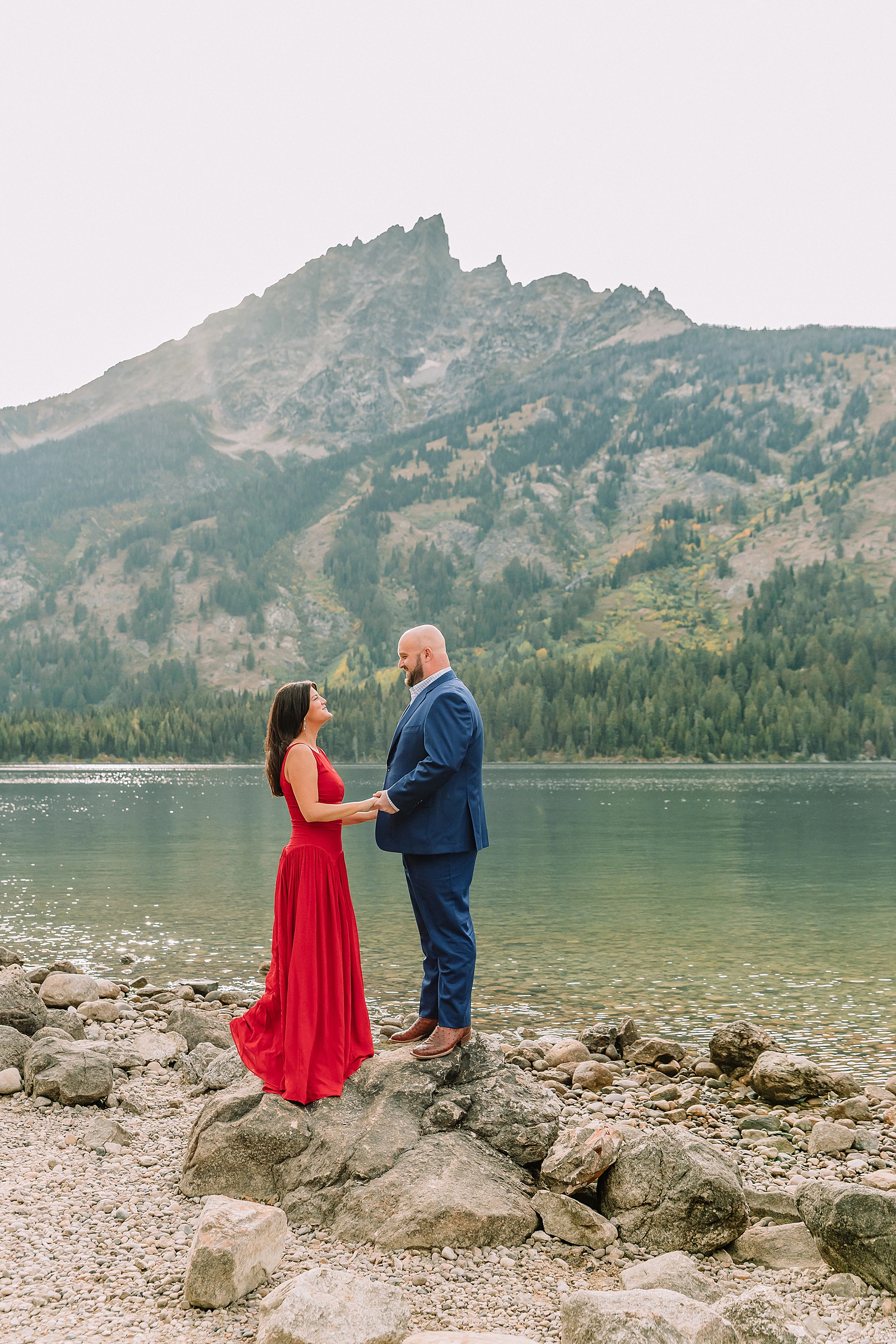 Grand Teton National Park engagement photos Jenny Lake engagement session Wyoming dressy engagement session outfit ideas Couple poses ideas What to wear for your engagement session