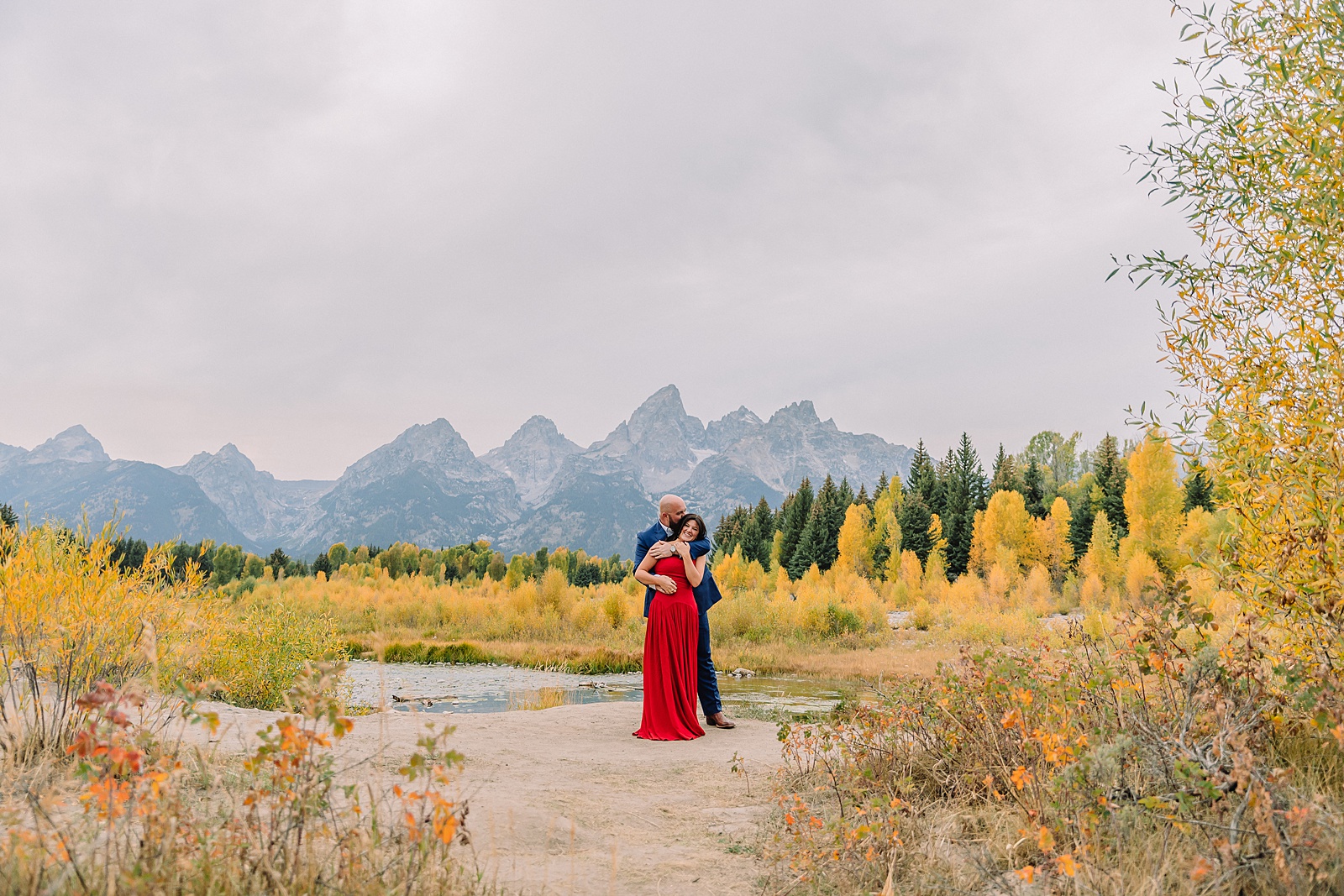 Schwabacher Landing sunset engagement photos mountain engagement photos Grand Tetons multiple outfit engagement photo session Jackson Hole Engagement Photographer