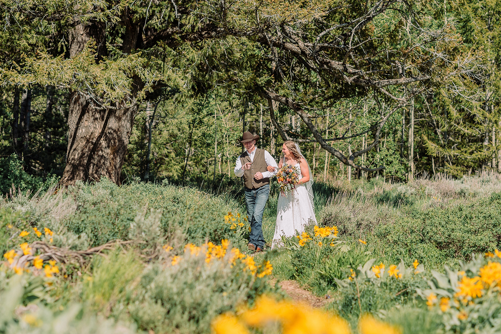 Wyoming wedding photographer Grand Teton National Park ceremony The Wedding Tree Bridger-Teton National Forest wedding photos Bride first look with dad Wyoming mountain wedding Yellow wildflower wedding photos Jackson Hole Wyoming Jackson Hole wedding photographer