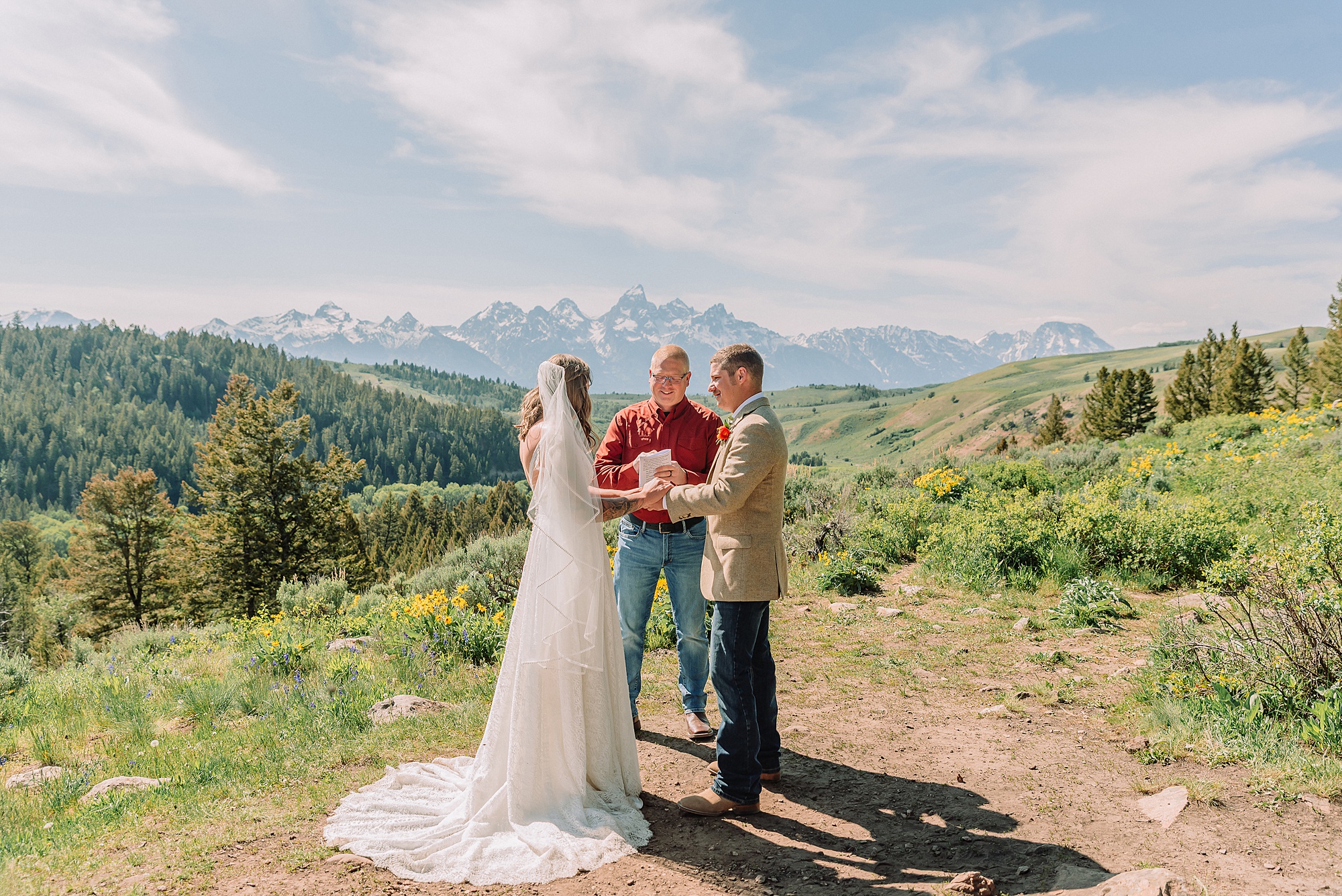 Wyoming wedding photographer Grand Teton National Park ceremony The Wedding Tree Bridger-Teton National Forest wedding photos Wyoming mountain wedding photographer Yellow wildflower wedding photos Jackson Hole Wyoming Jackson Hole wedding photographer