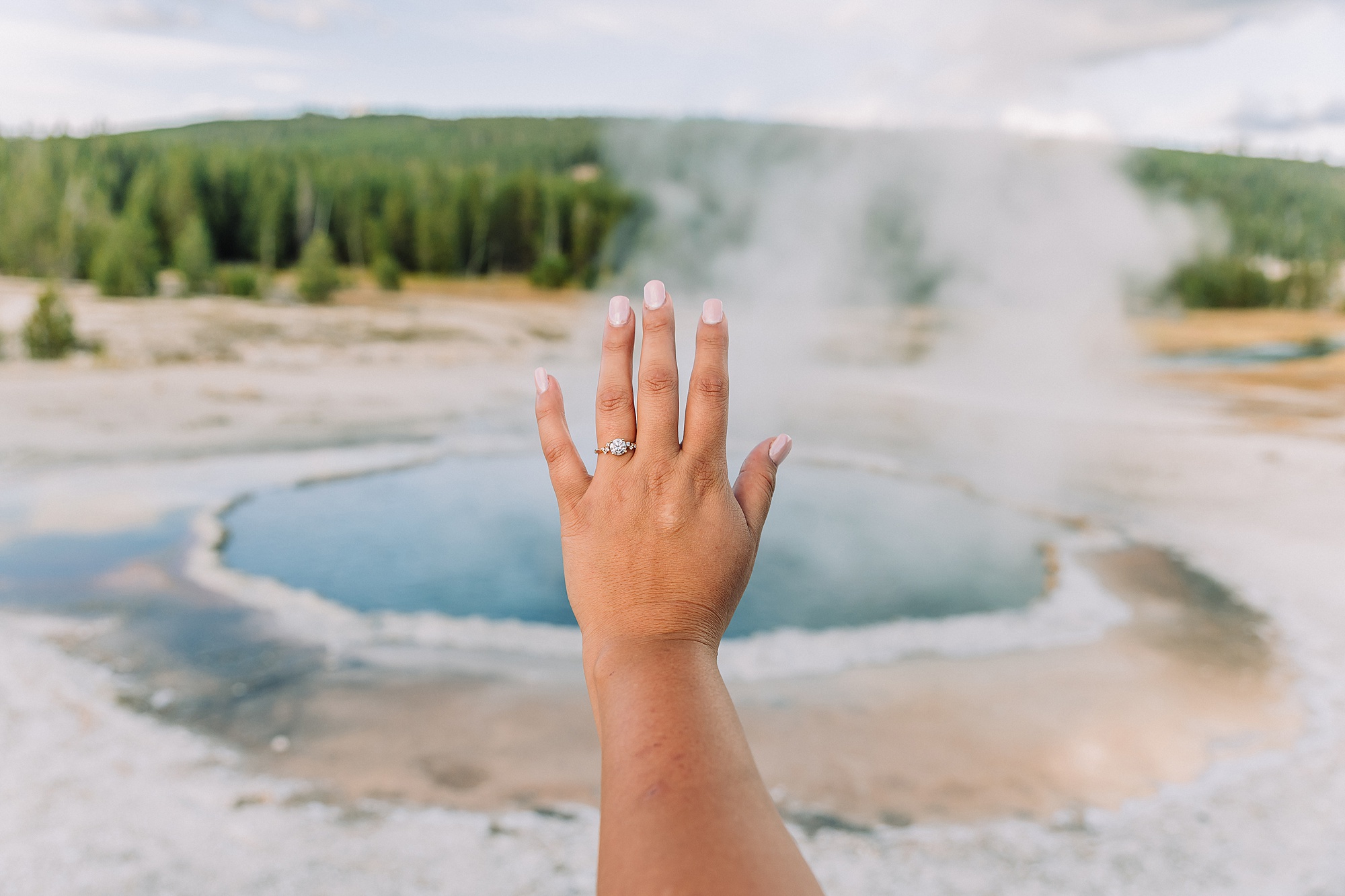Yellowstone engagement photos at Castle Geyser Old Faithful Inn engagement session Upper Geyser Basin engagement photography Firehole River bridge engagement photos Castle Geyser proposal location photos