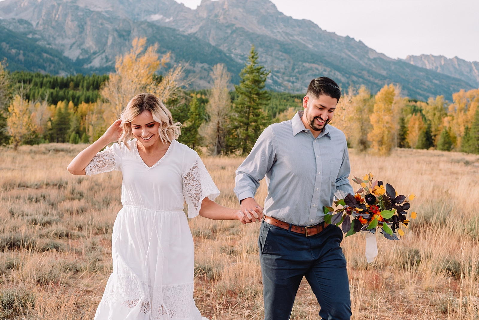 bride and groom in front of Tetons mountains
