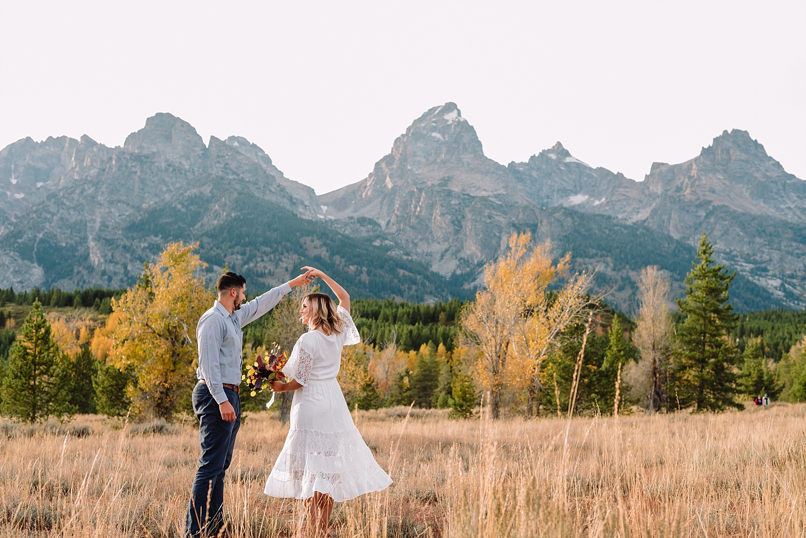 bride and groom in front of Tetons