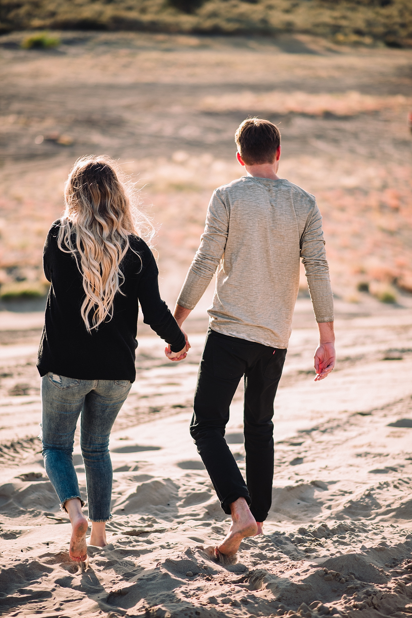 sandy desert couple walking together