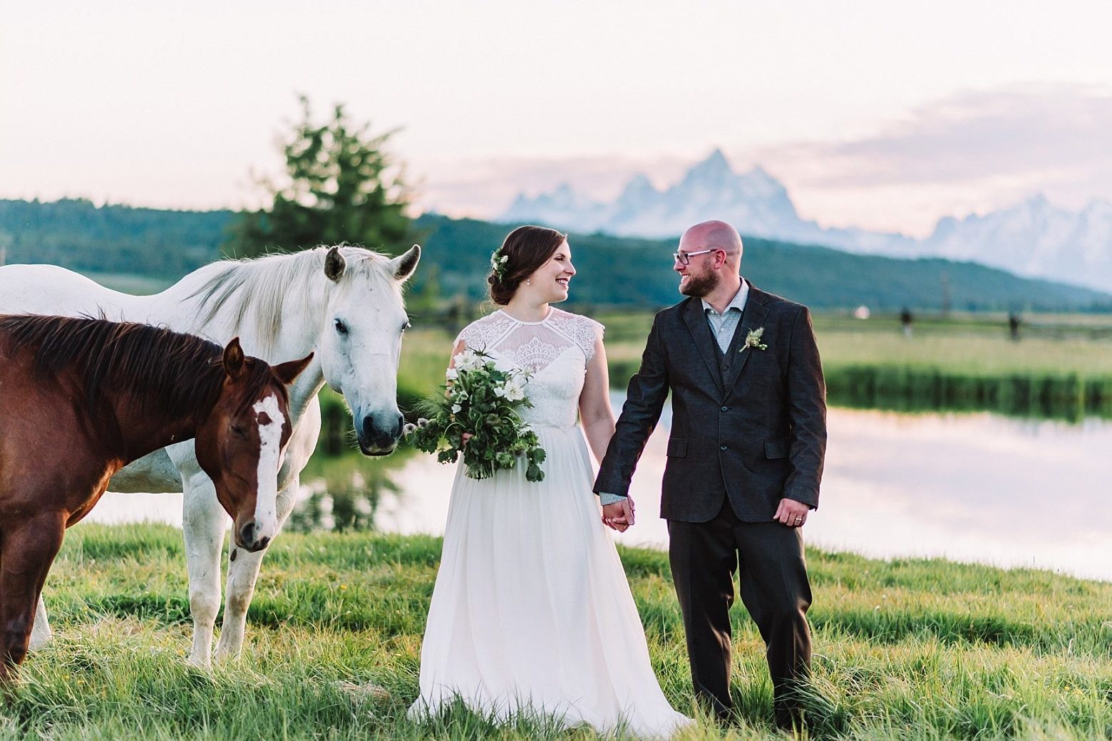 bride and groom with horses whimsical dreamy romantic