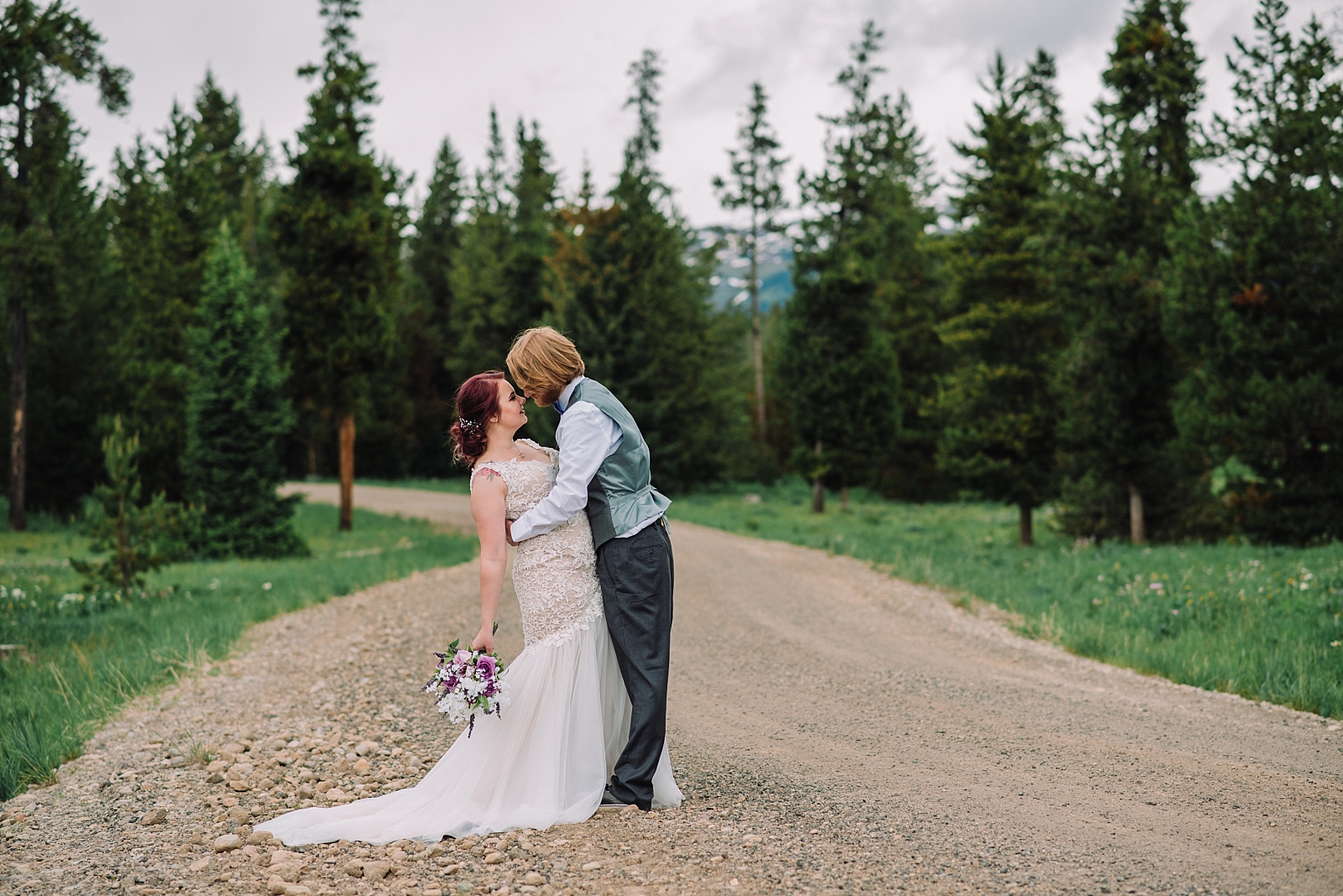 bride and groom in dirt road