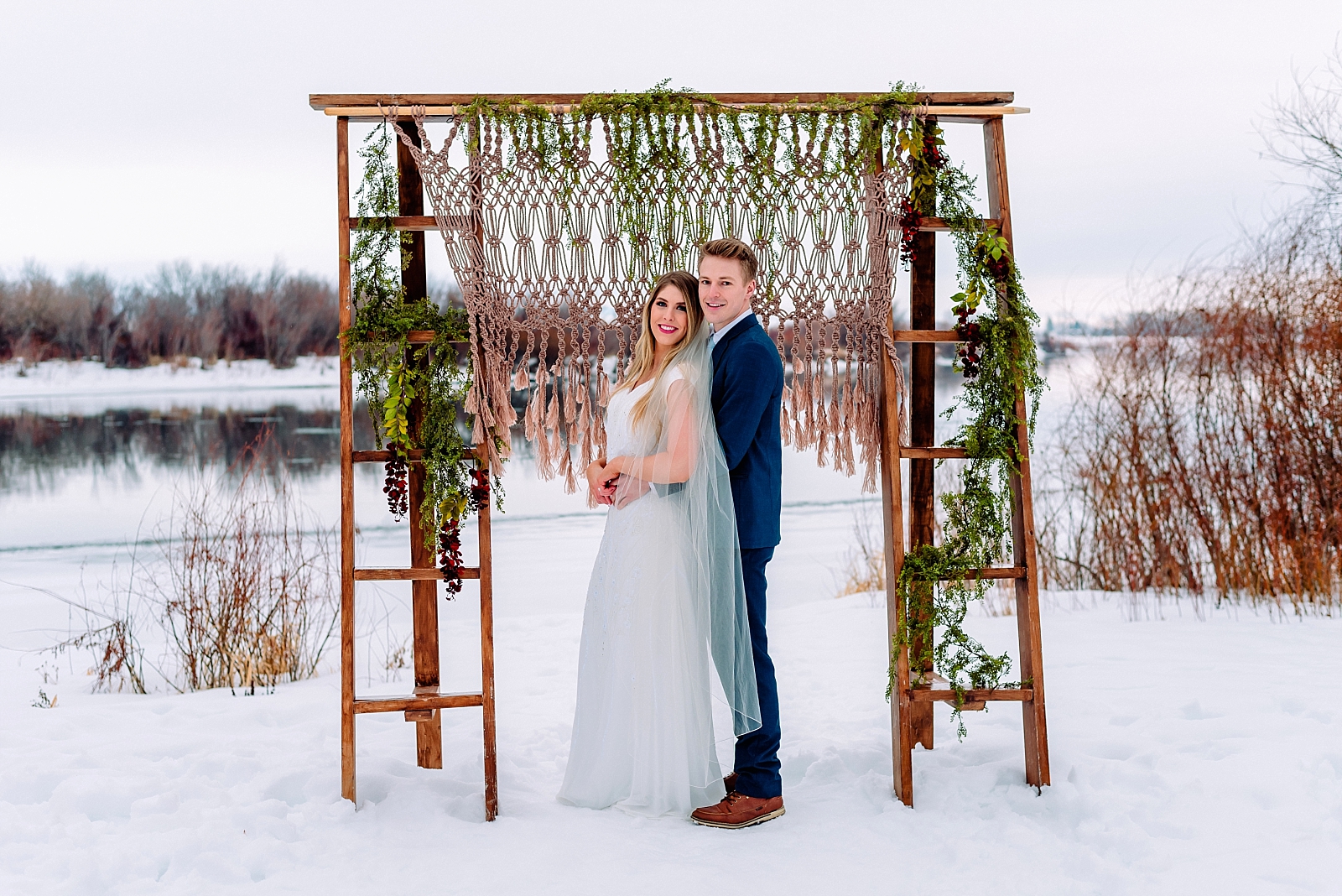 bride and groom macrame backdrop winter