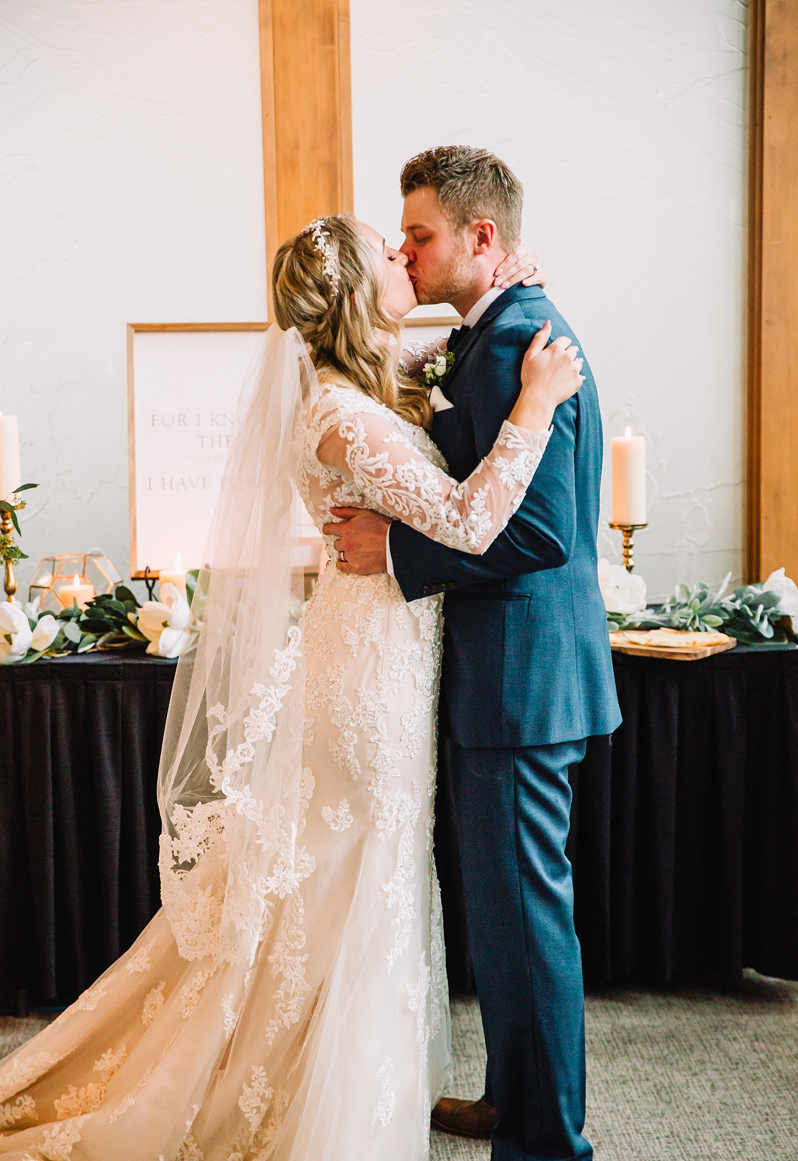 teton pines indoor jackson hole wedding first kiss bride and groom