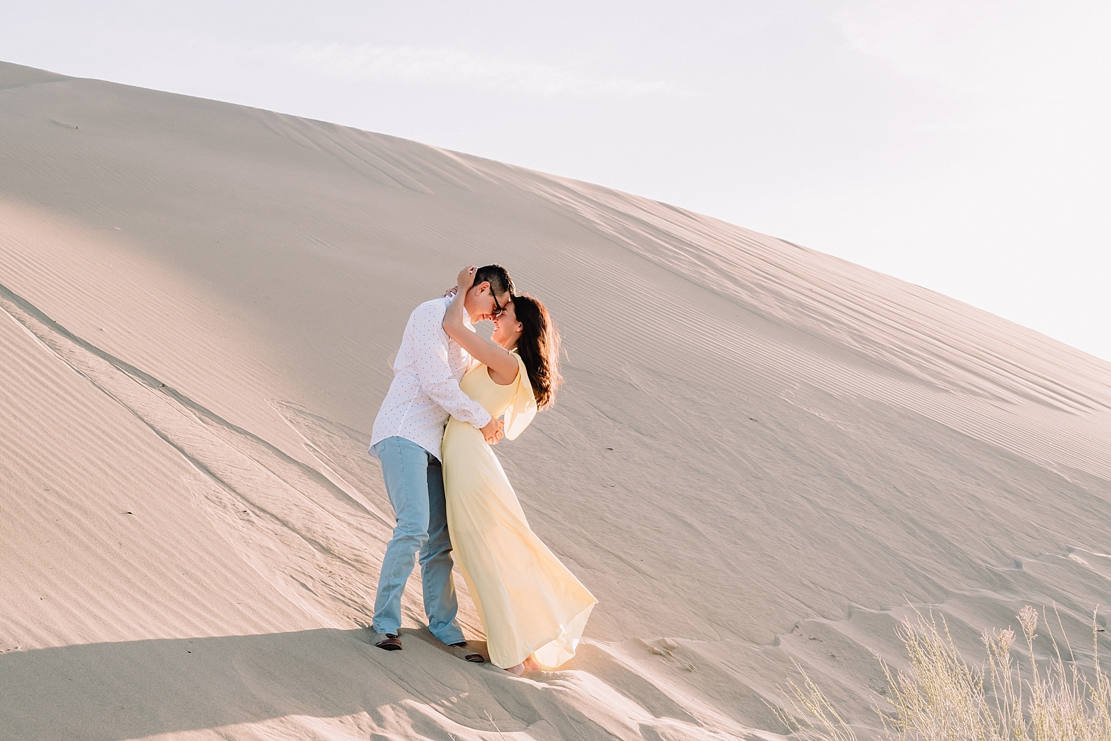 romantic couple sand dune idaho engagements