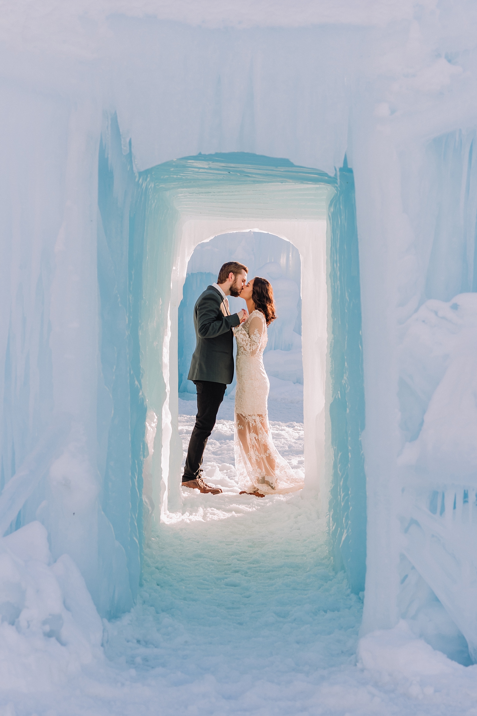 elopement ice palace groom and bride kissing
