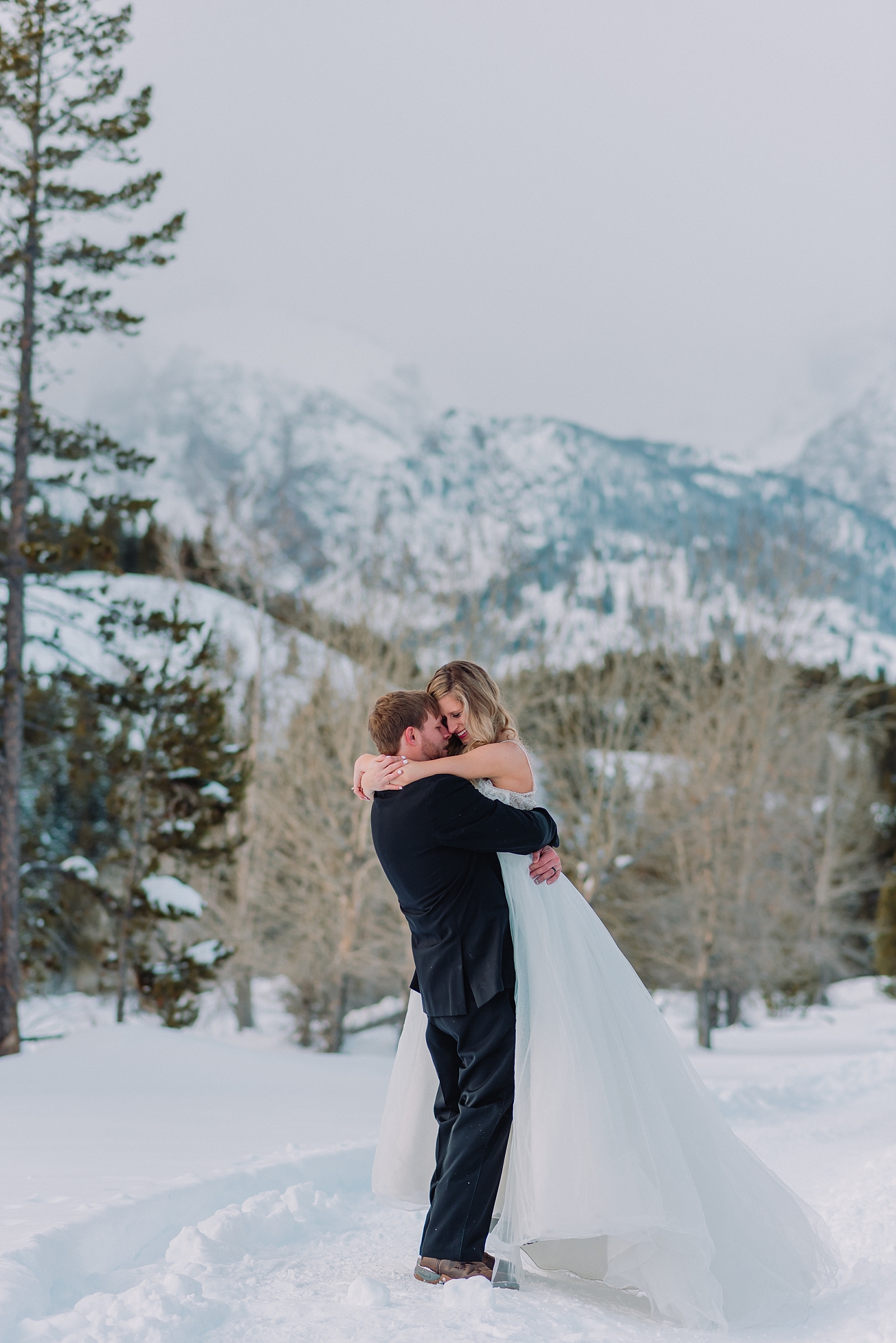 bride-and-groom-twirling-and-dancing-under-the-mountains-teton-national-park-gtnp-jackson-hole-destination-wedding-photographer-wyoming-elopement-