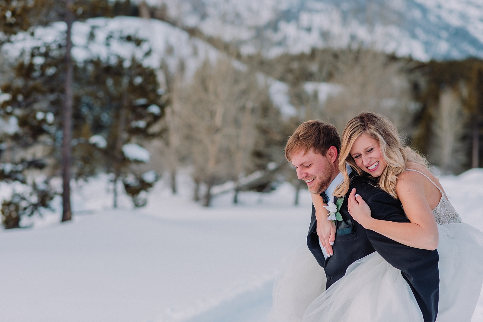elopement-in-the-tetons-grand-teton-national-park-couple-under-the-mountains-snow-winter-bride-and-groom
