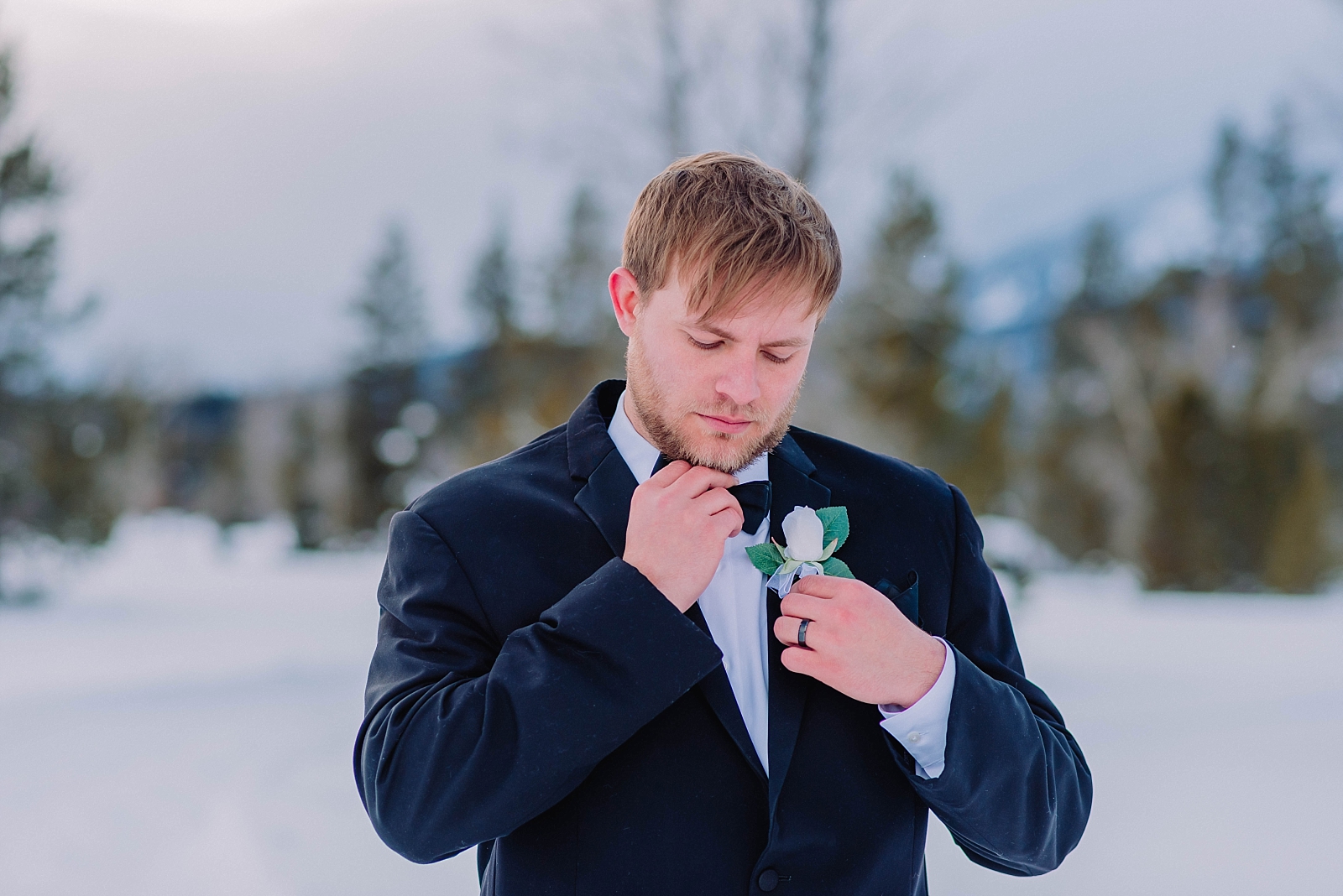elopement-in-the-tetons-grand-teton-national-park-couple-under-the-mountains-snow-winter-bride-and-groom-jackson-hole-wyoming-romantic-classy-elegant-timeless