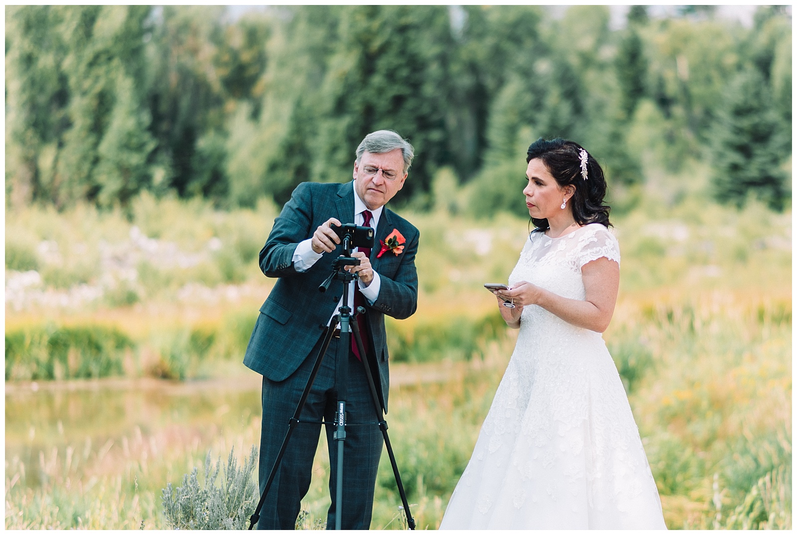groom sets up camera to live stream wedding ceremony