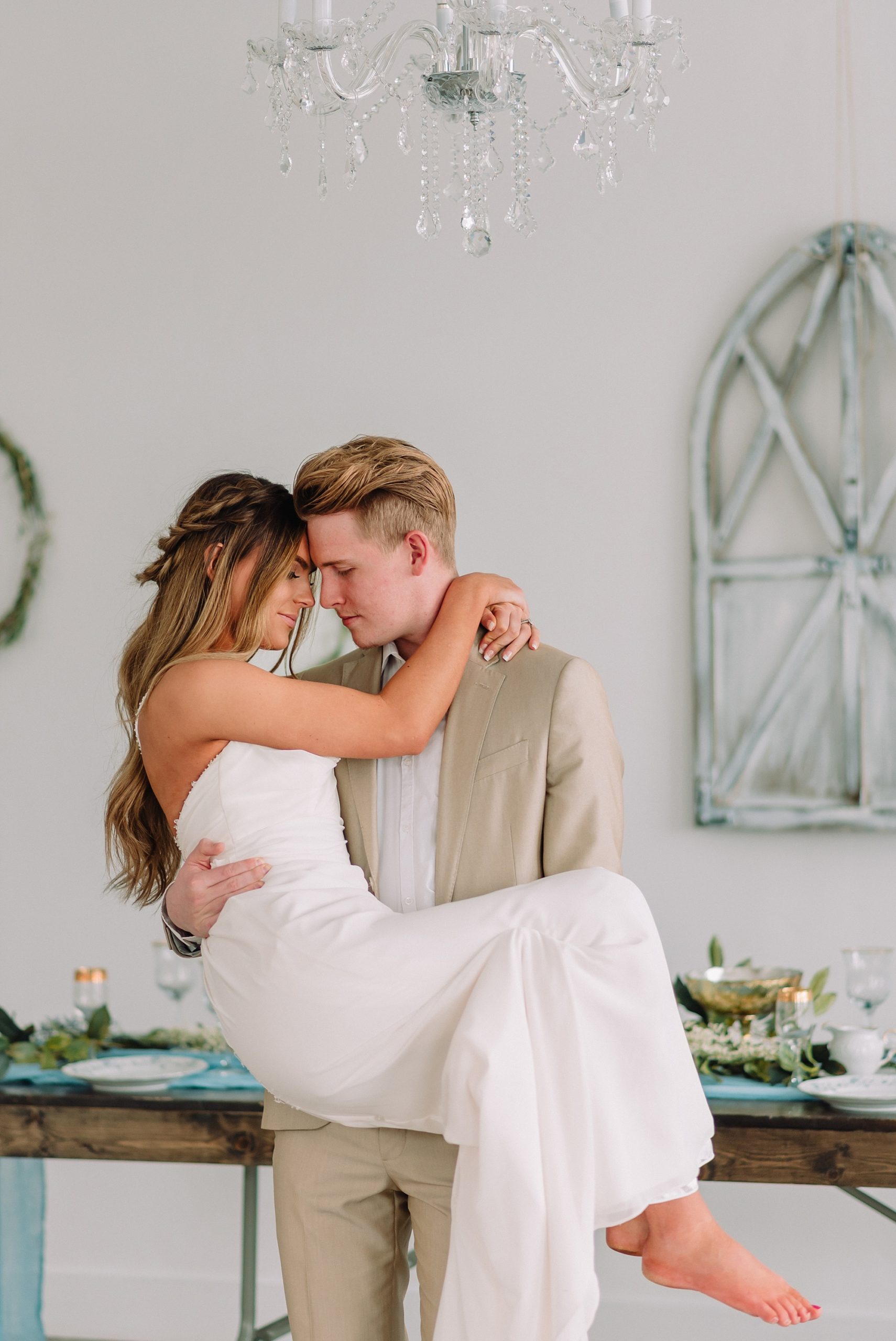 groom-carrying-bride-rexburg-idaho-wedding-photographer-elopement-inspiration-blue-and-gold-intimate-wedidng-romantic-passionate-sexy