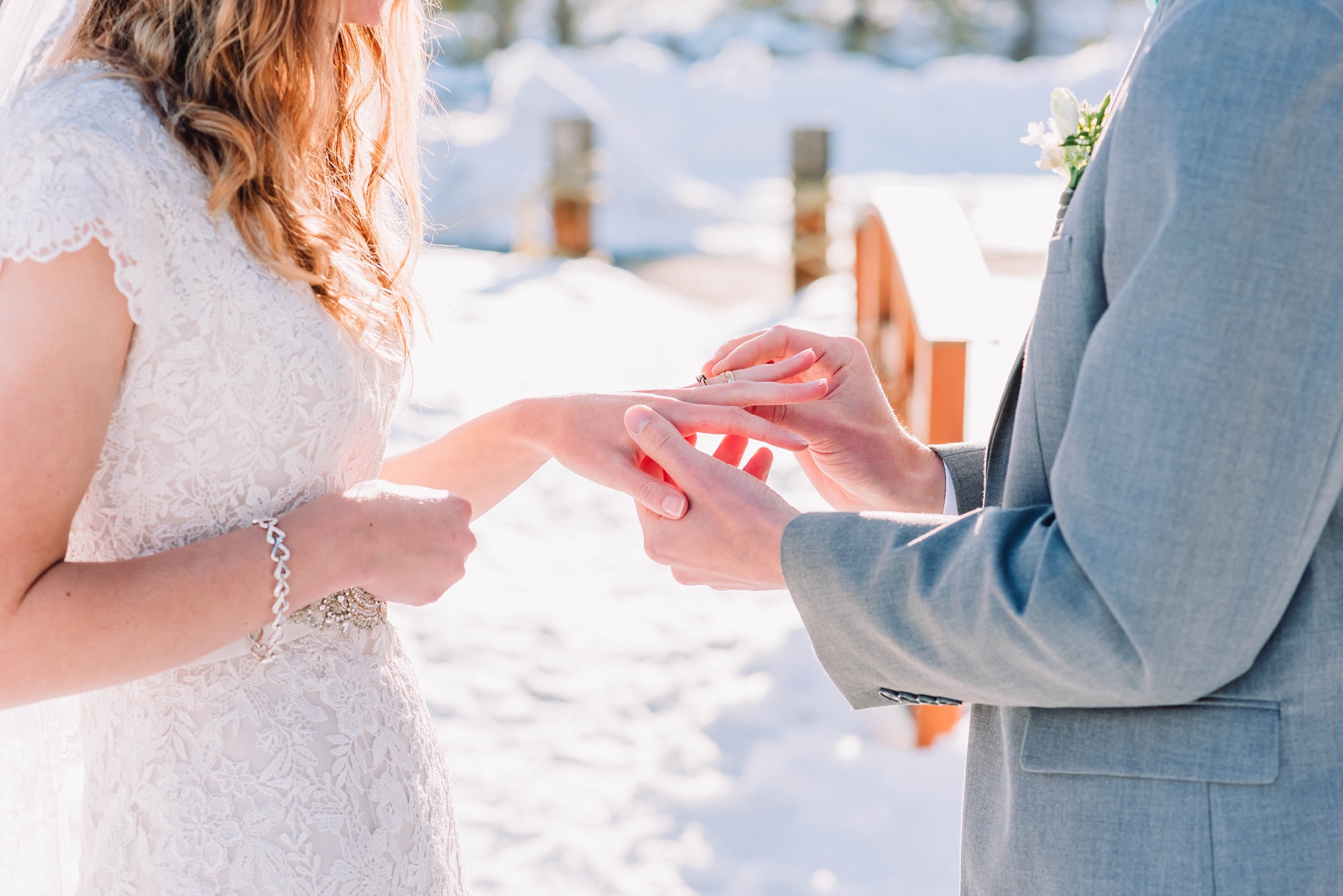wedding-ring-exchange-voews-ceremony-idaho-photographer-winter-snow