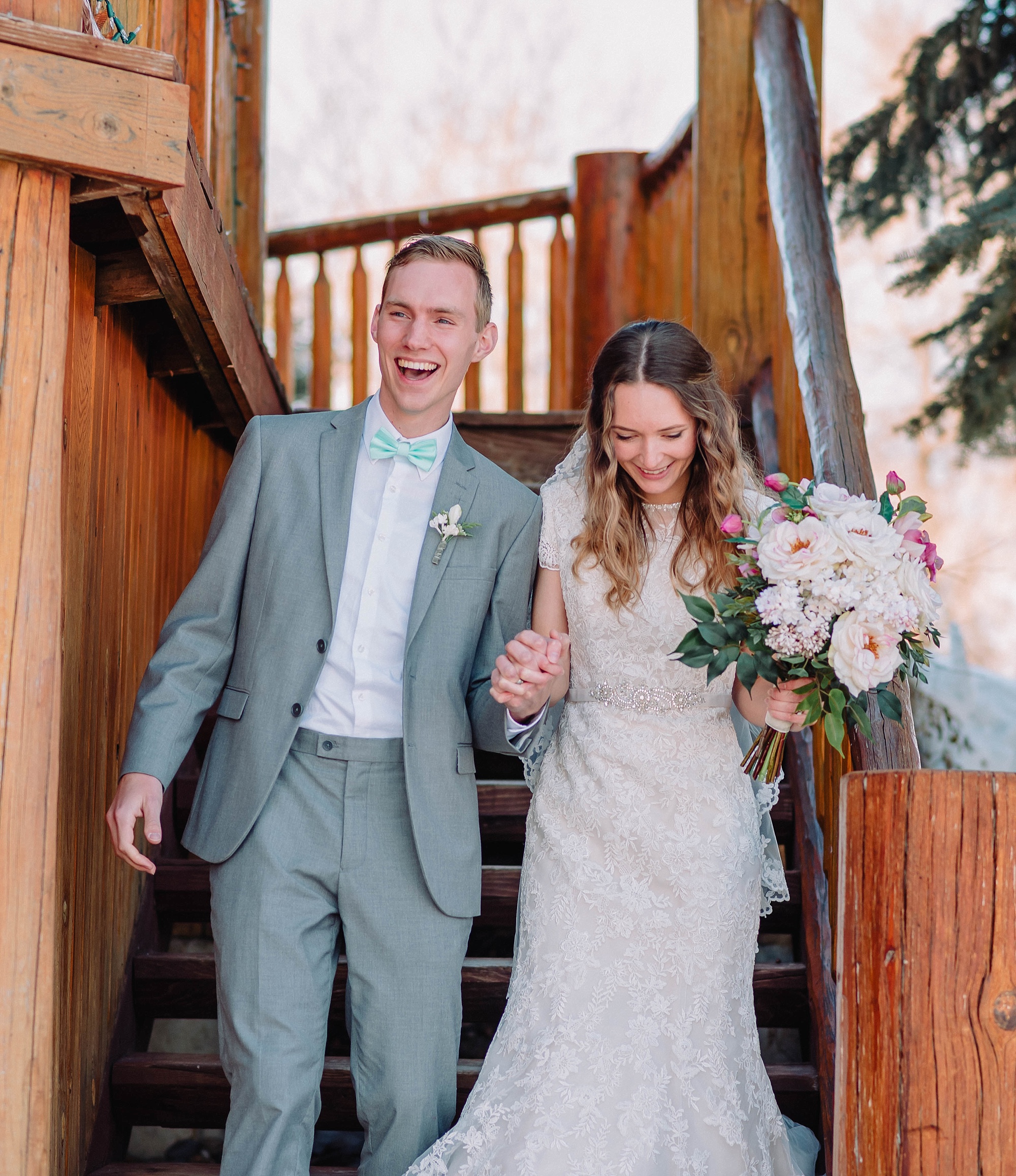 bride and groom on cabin staircase