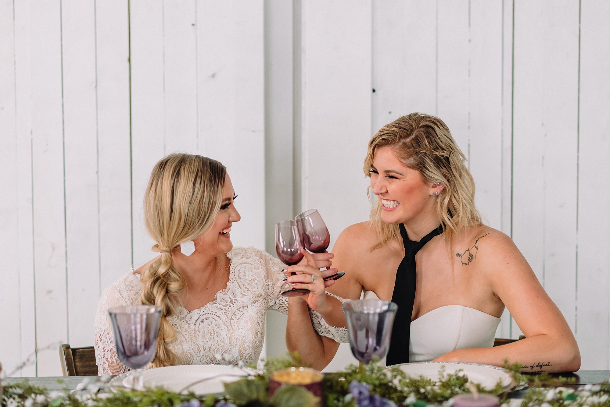 brides toasting at wedding reception styled elopement