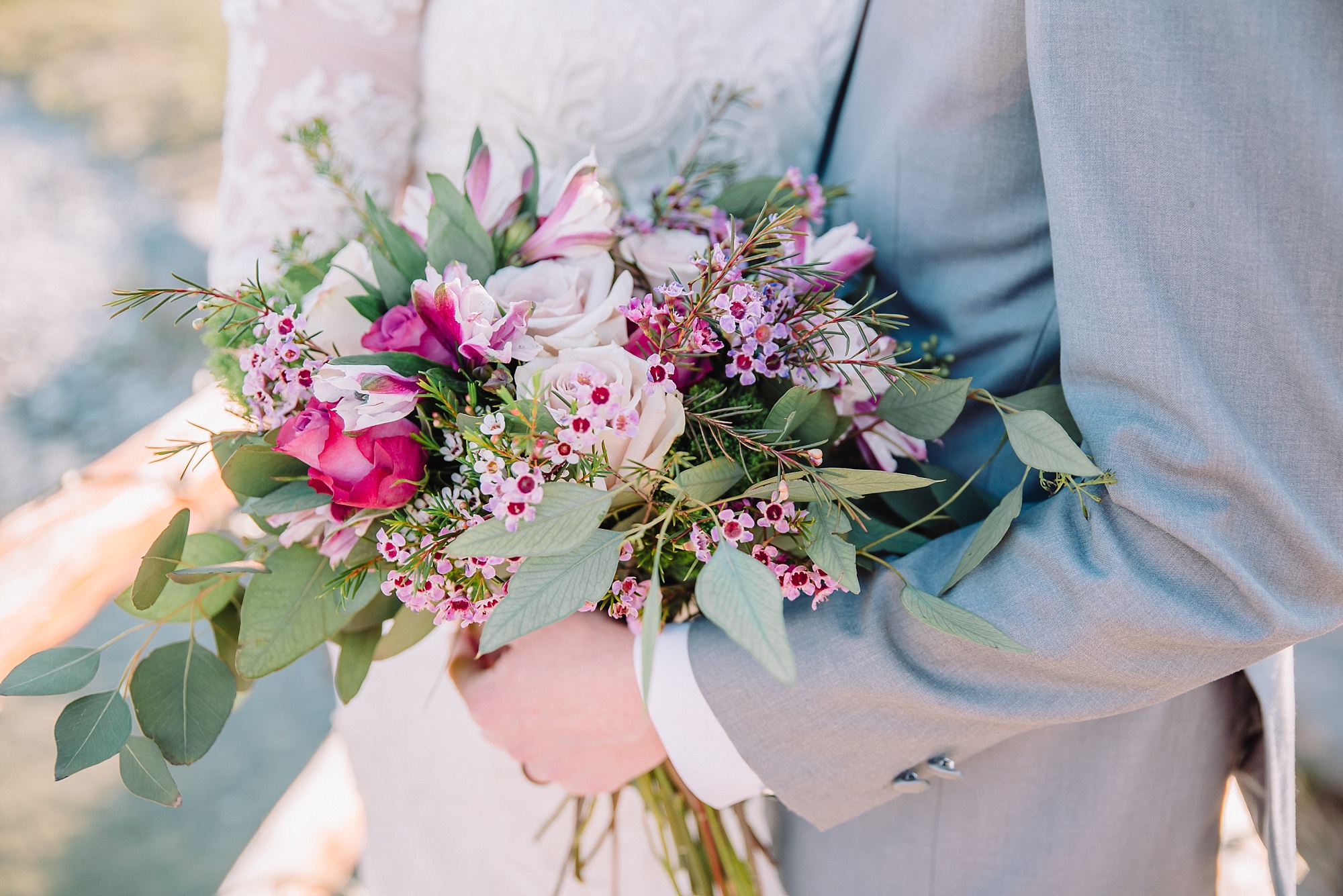bridal bouquet filled with purple and pink florals