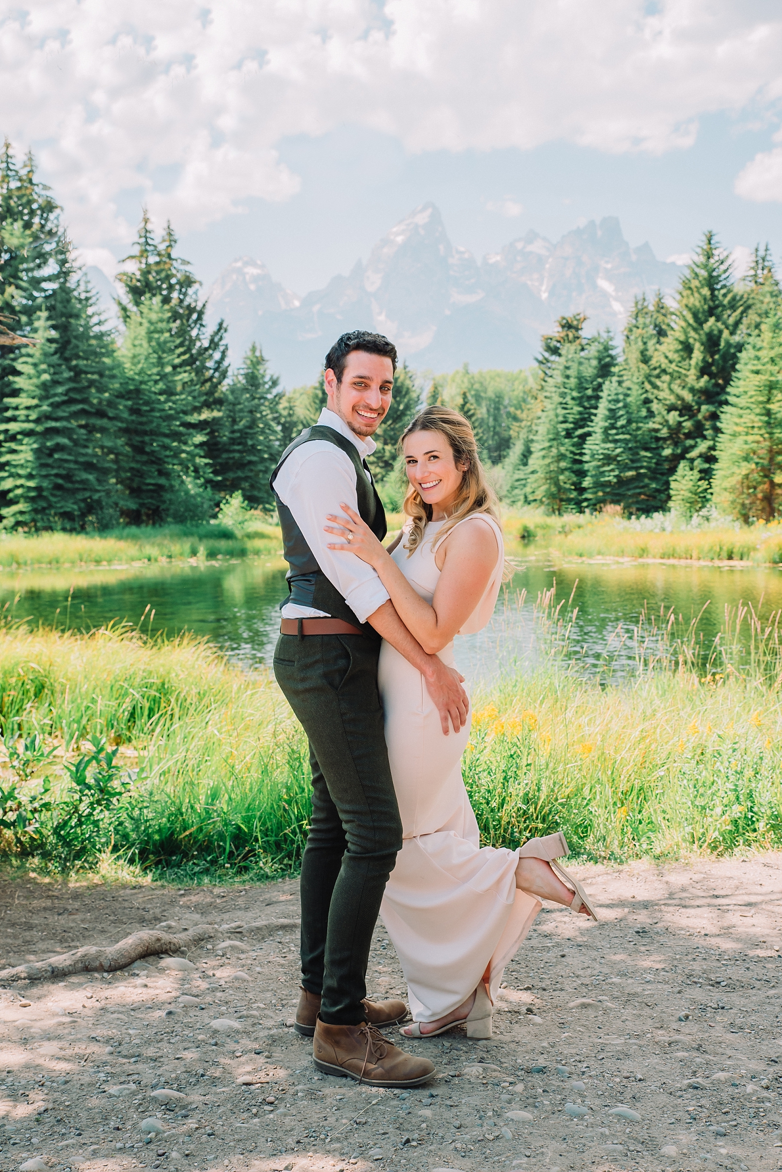 bride and groom with mountains tetons