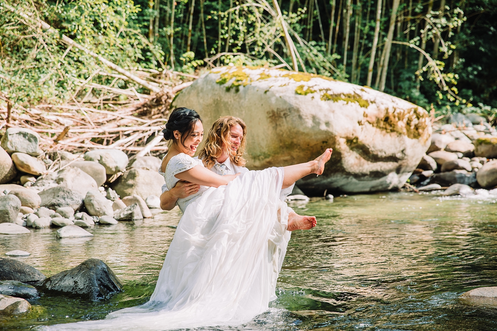 bride and groom in water river wedding clothes