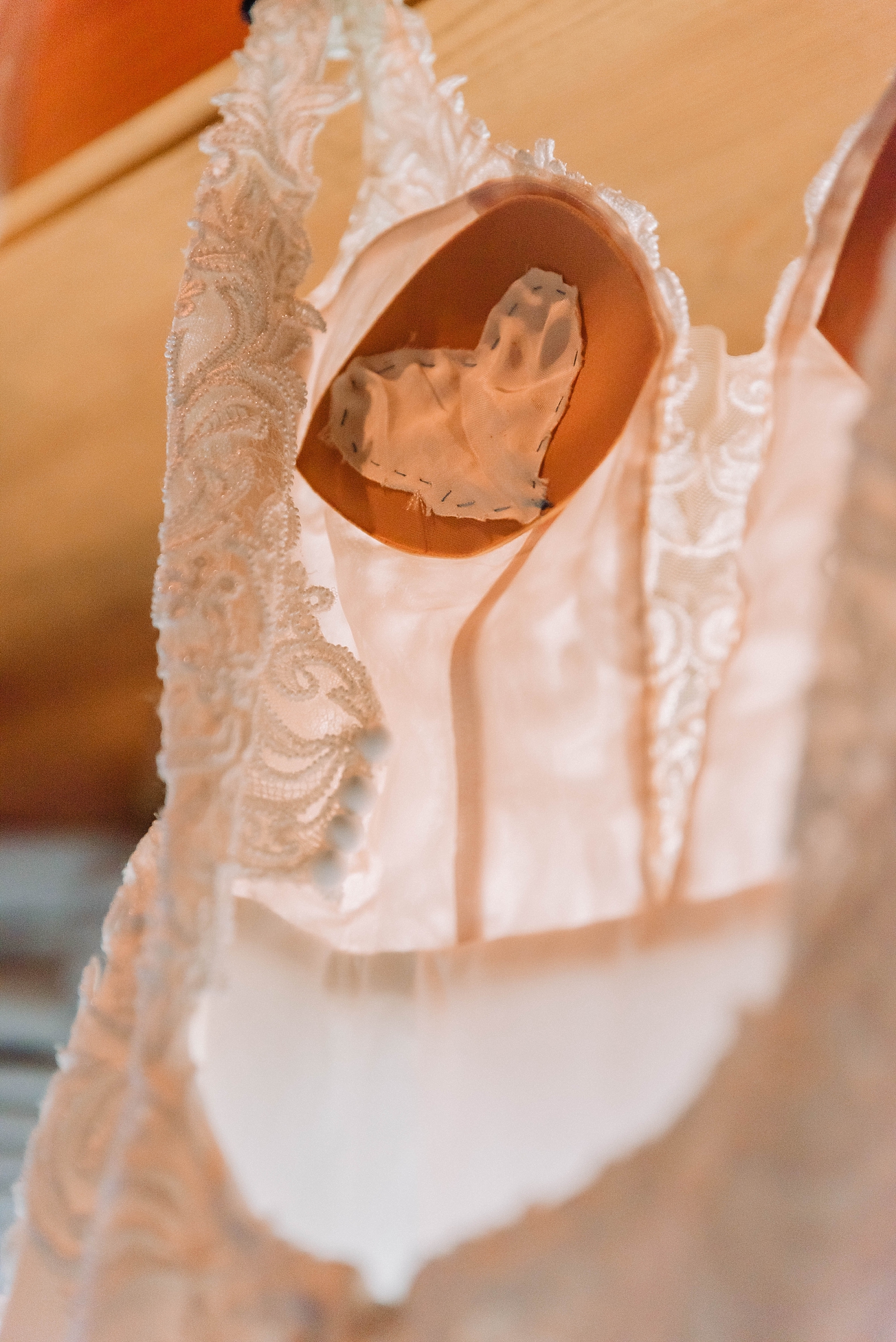 Bride's dress with heart of fabric from mother's wedding gown sewed in over her heart to keep her with her