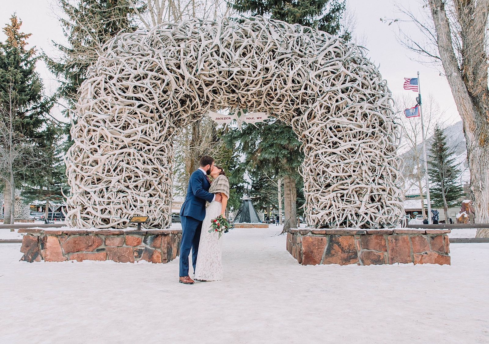 couple posing in wedding attire at jackson hole one of my favorite honeymoon locations