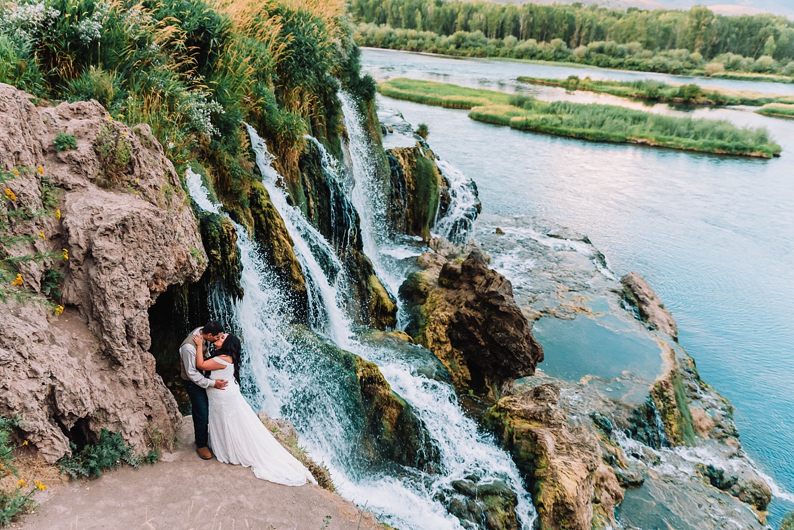 Bride and Groom kissing at Fall Creek Falls in Swan Valley Idaho