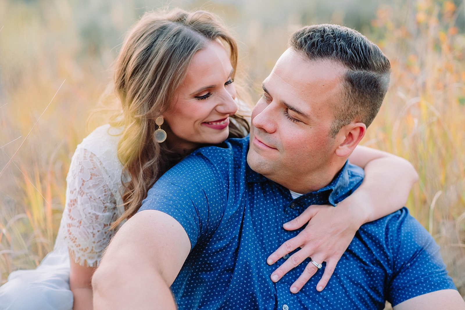 couple portraits in tall golden grass