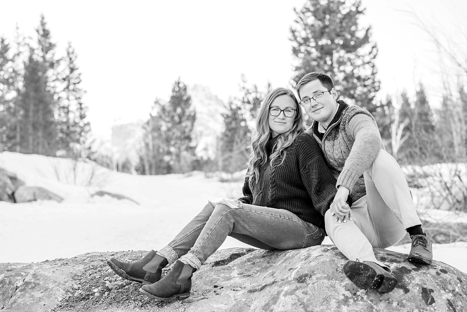 couple sitting on a rock during outdoor couples portraits