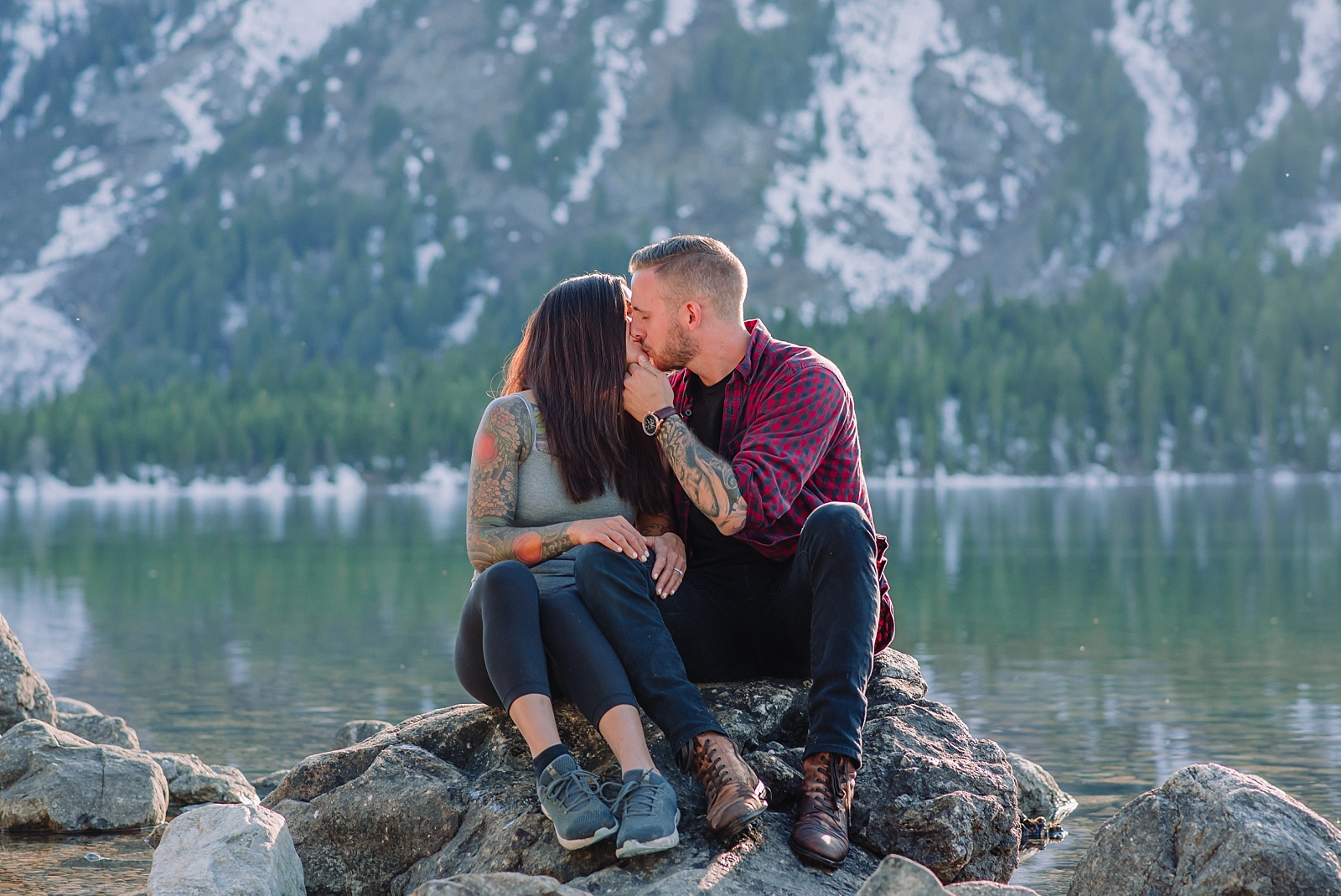 couple kisses during engagement photos