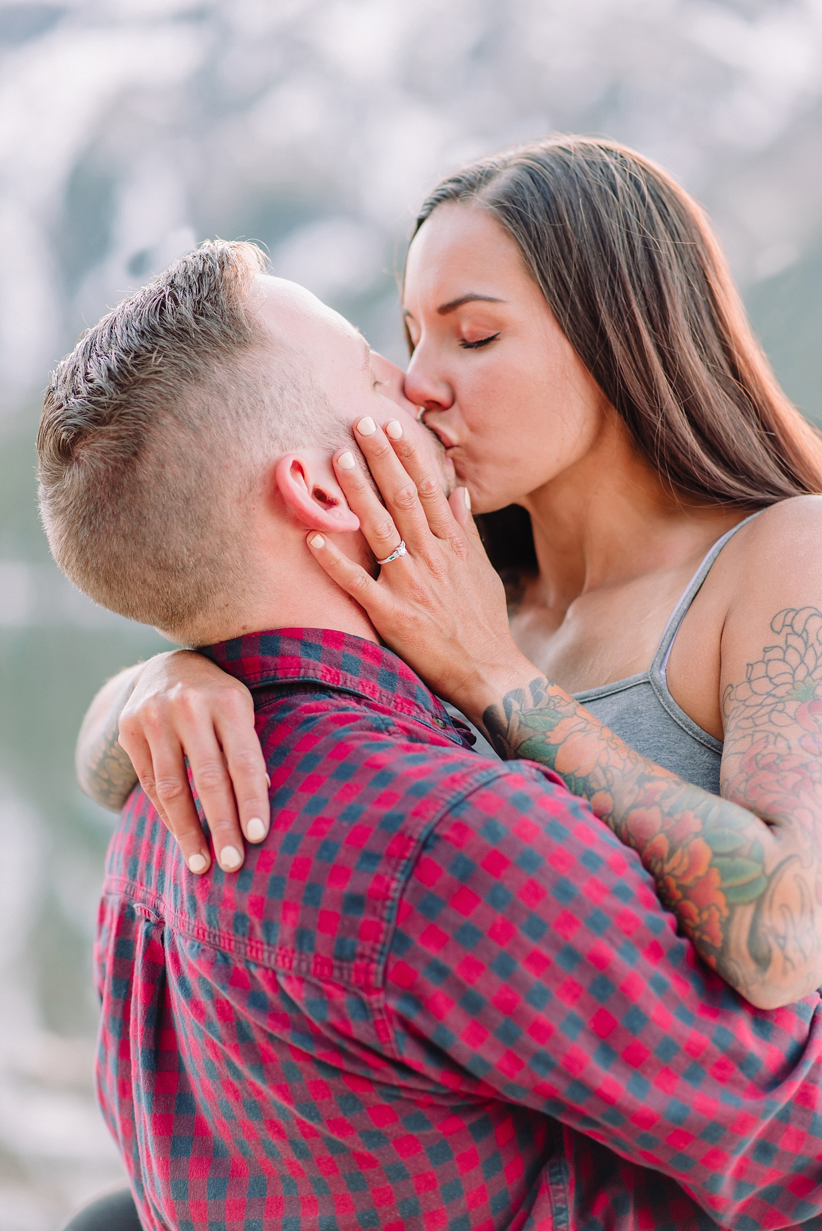 couple kisses during engagement photos